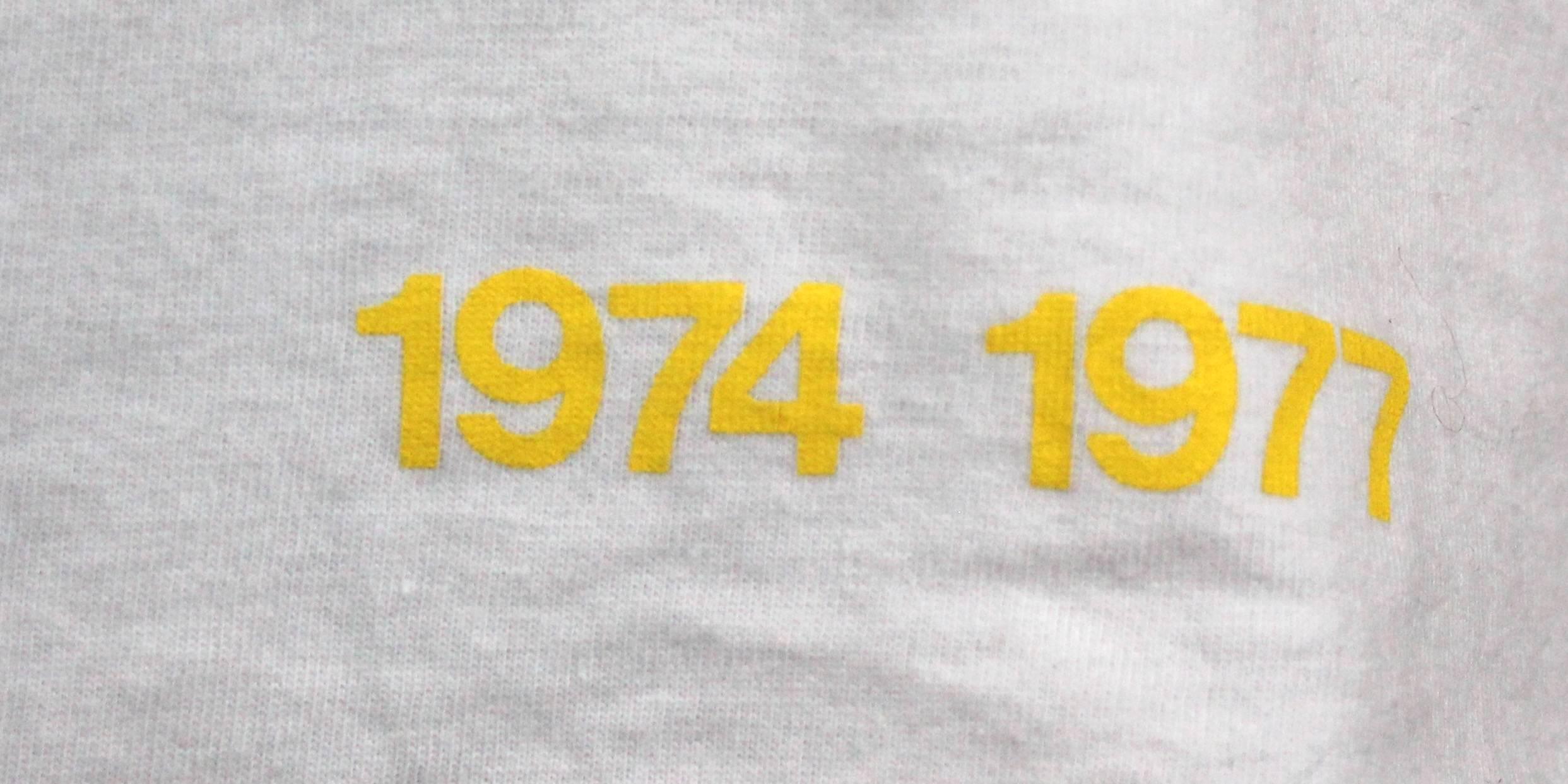 -Vivienne Westwood t-shirt with SEX logo (SEX was the name of Vivienne Westwood's store from 1974 - 1977) 
-Has text in yellow that reads : 