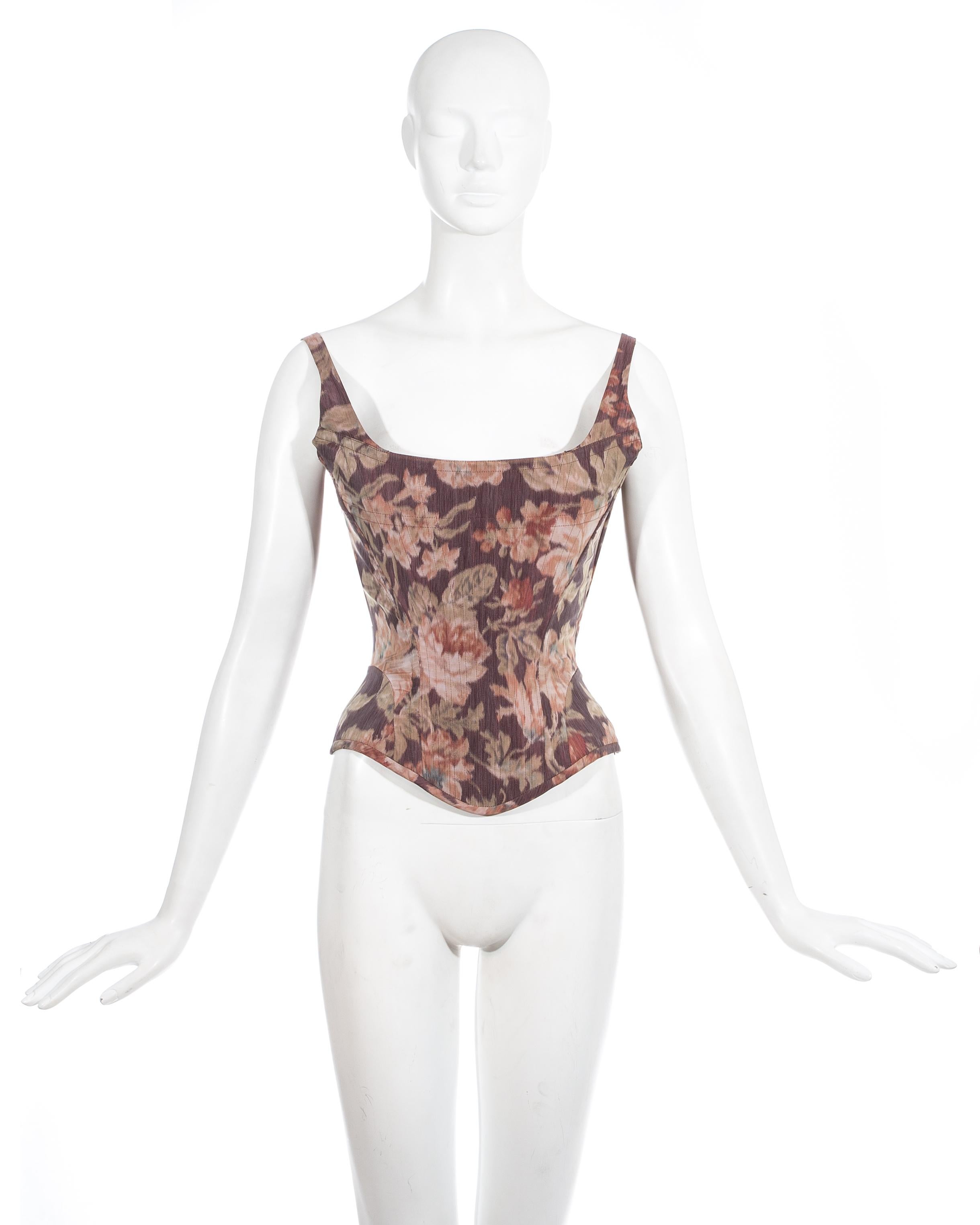 Vivienne Westwood; couture pink floral silk taffeta evening corset with lace up fastening at the rear, internal boning and hidden side zip closure. Designed to chinch the waist and push the breasts up.

Fall-Winter 1997
