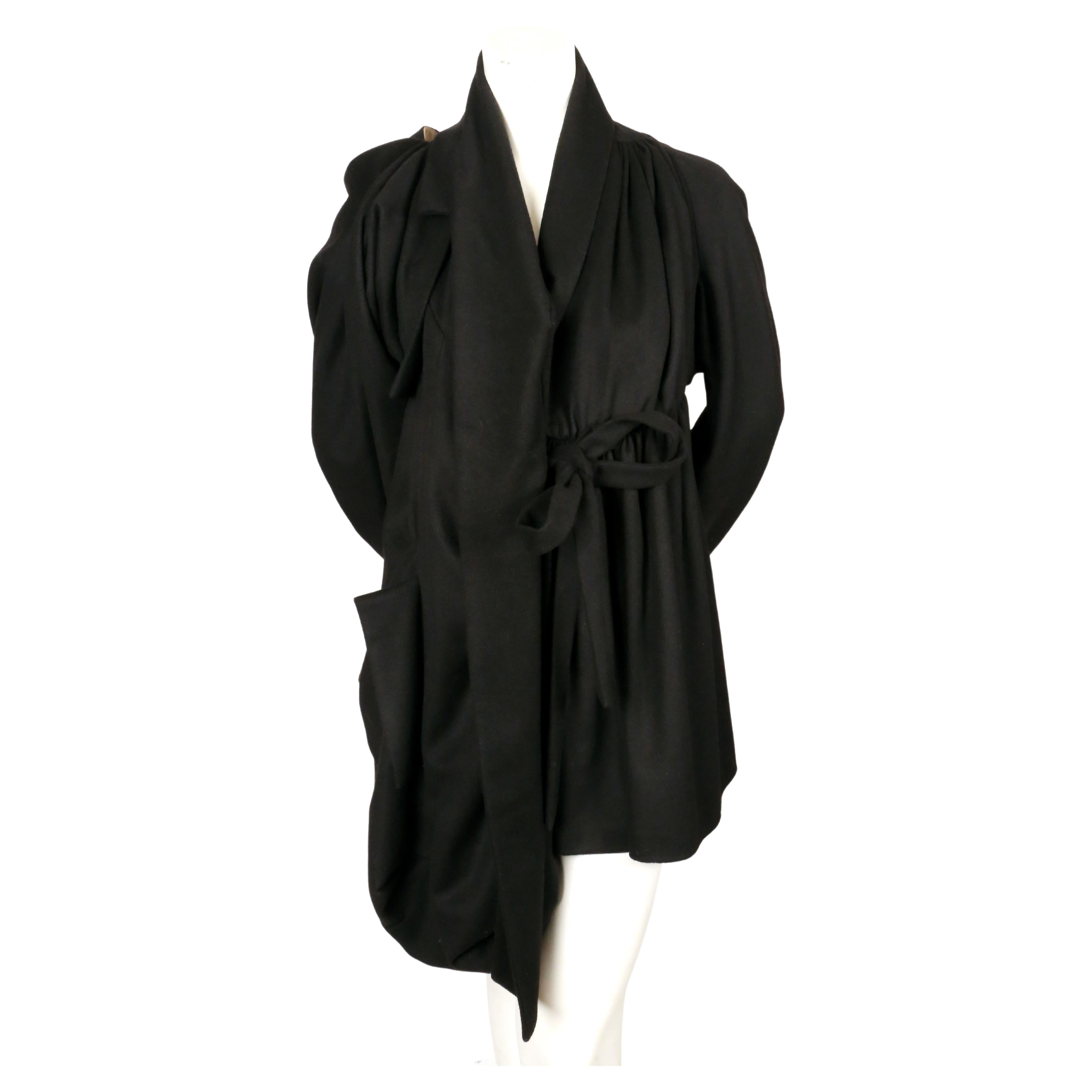 Dramatic, draped, black wool coat with asymmetrical front from Vivienne Westwood. UK size 14 which can fit a US 4-8. Approximate measurements:  bust 40