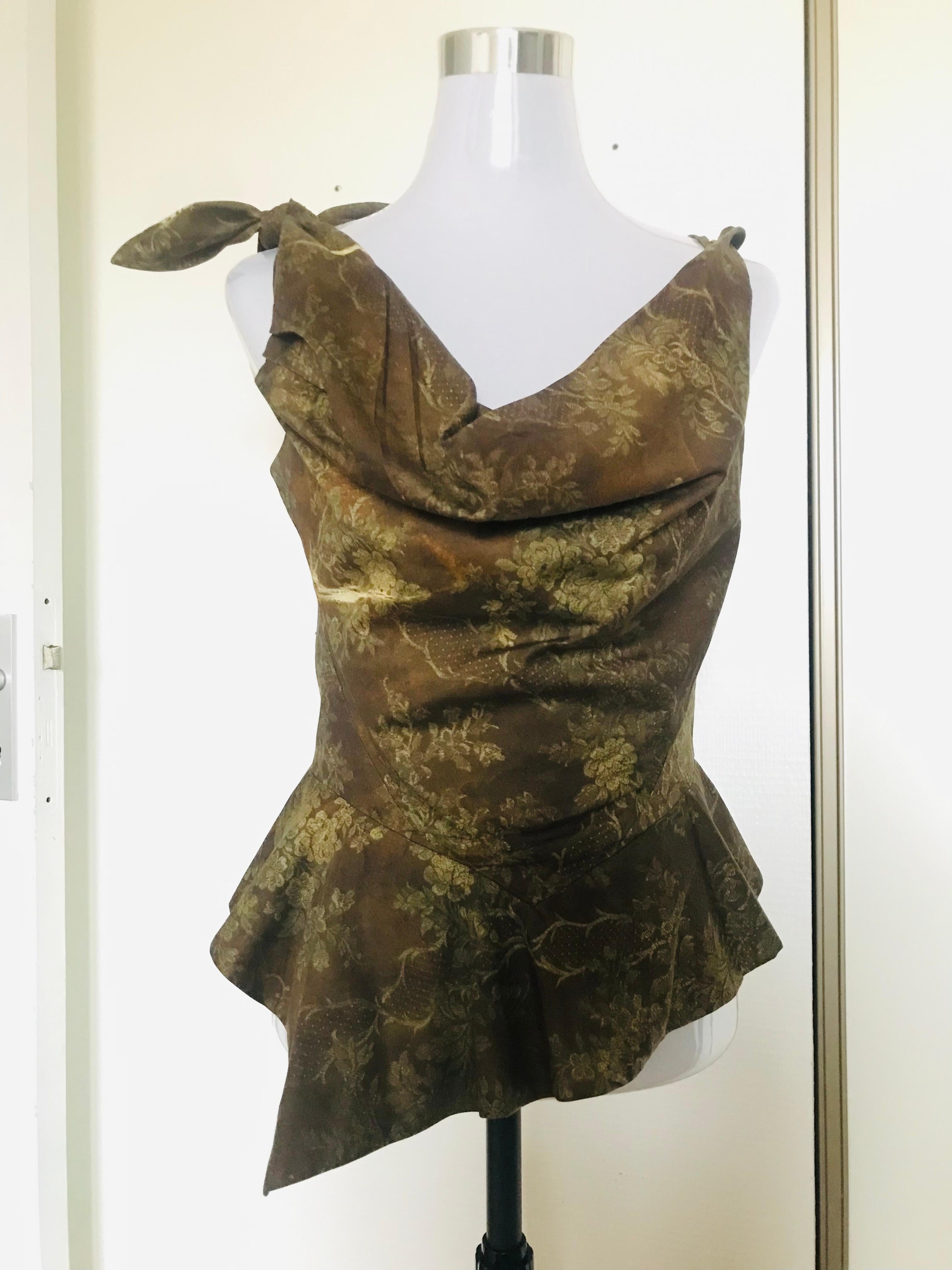 Top bustier corsetto Vivienne Westwood. In ottime condizioni. Adatto a un 40 francese. Graziosa scollatura profonda. Curva e sposa le forme del corpo.