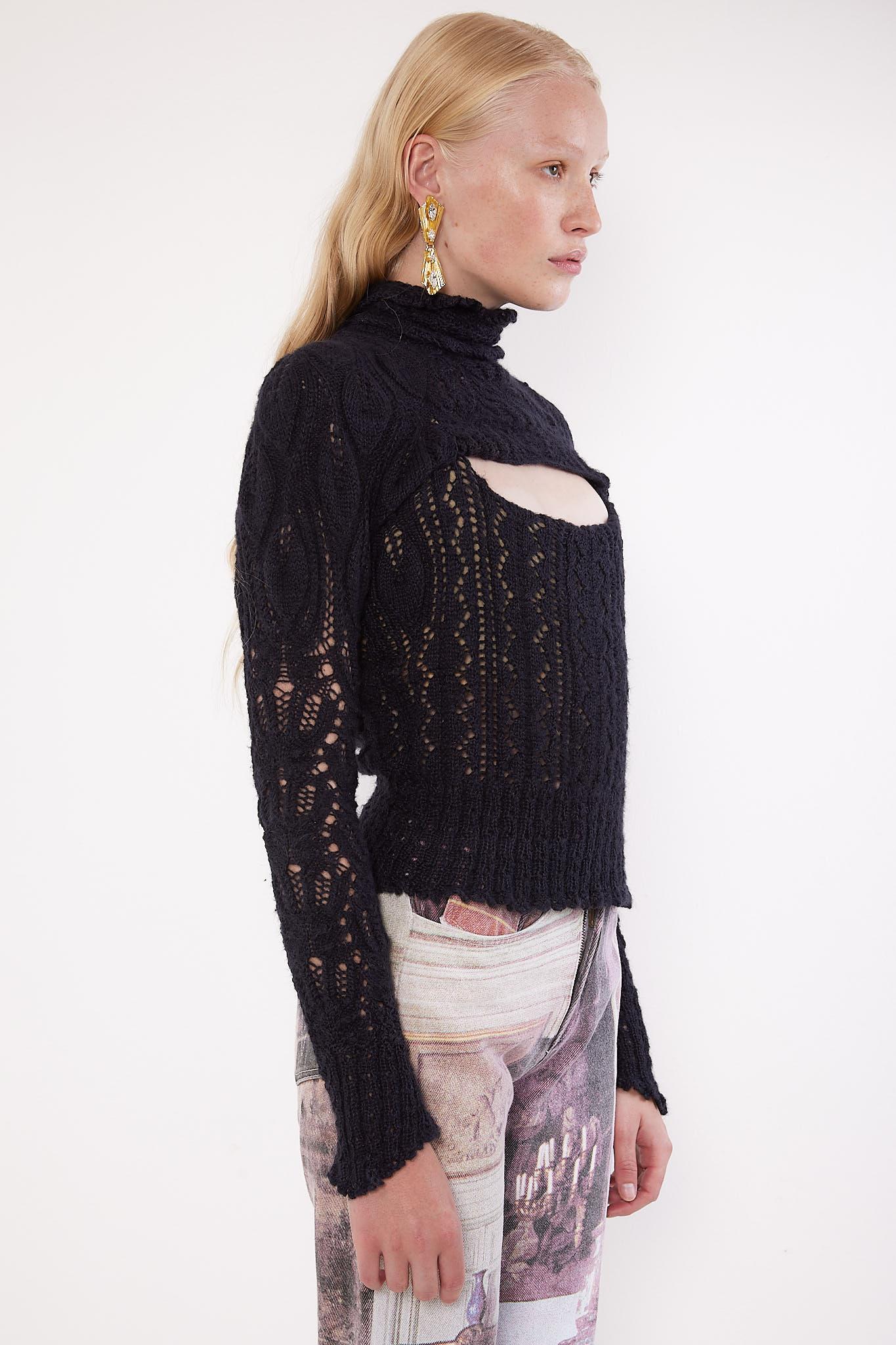Dating to the F/W 1993 'Anglomania' collection, this Vivienne Westwood Gold Label corset was made in England before production for the label was moved to Italy. Comprising a knitted crochet outer layered over a cropped internal corset, this features