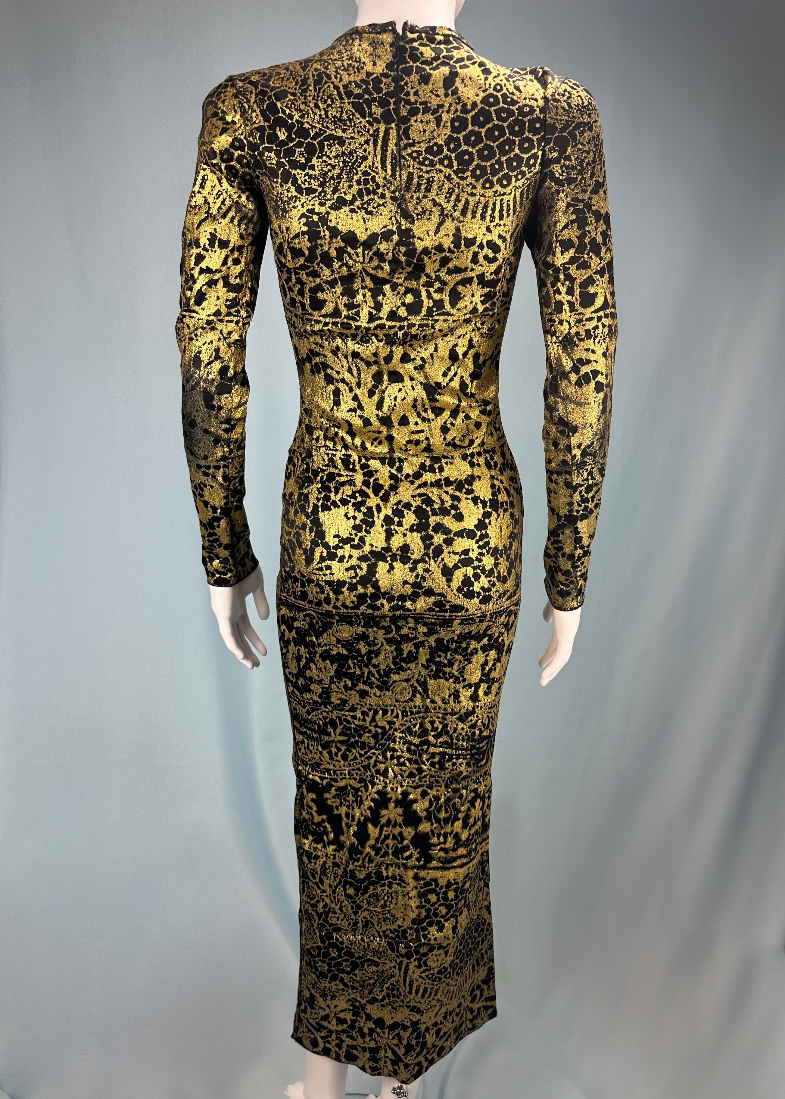 Vintage Vivienne Westwood
Fall 1992 “Always on Camera” collection 

Runway piece - this is the exact dress that was worn by model Anna Bayle on the Fall 1992 runway 

Black full length dress with gold glitter pattern all over
Stretch fabric
Long
