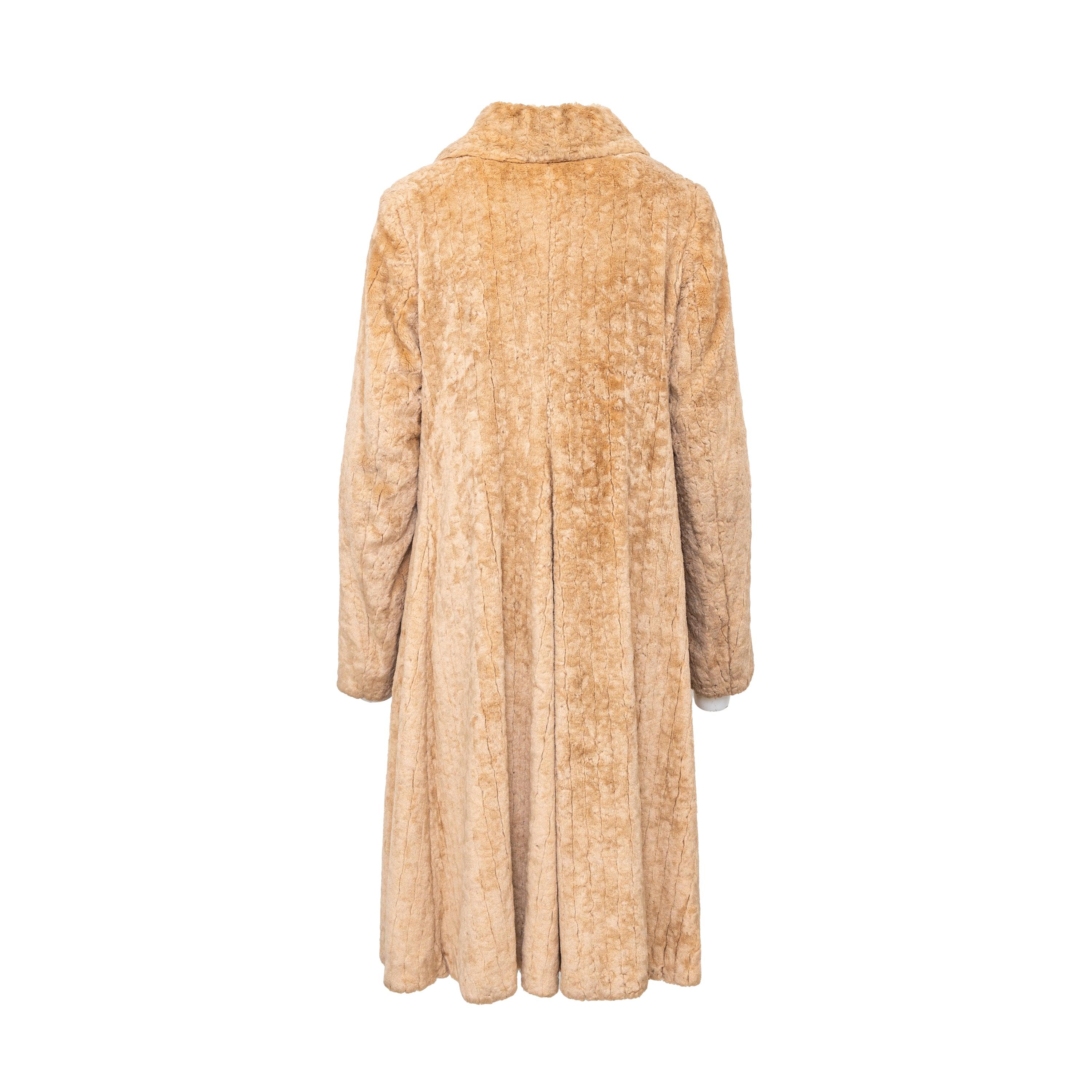 Stay warm and stylish with the Vivienne Westwood Faux Fur Coat. Made of a soft viscose and cotton blend, this beige coat features a double breasted design with signature buttons. The Peter Pan collar and front flap pockets add a touch of elegance,