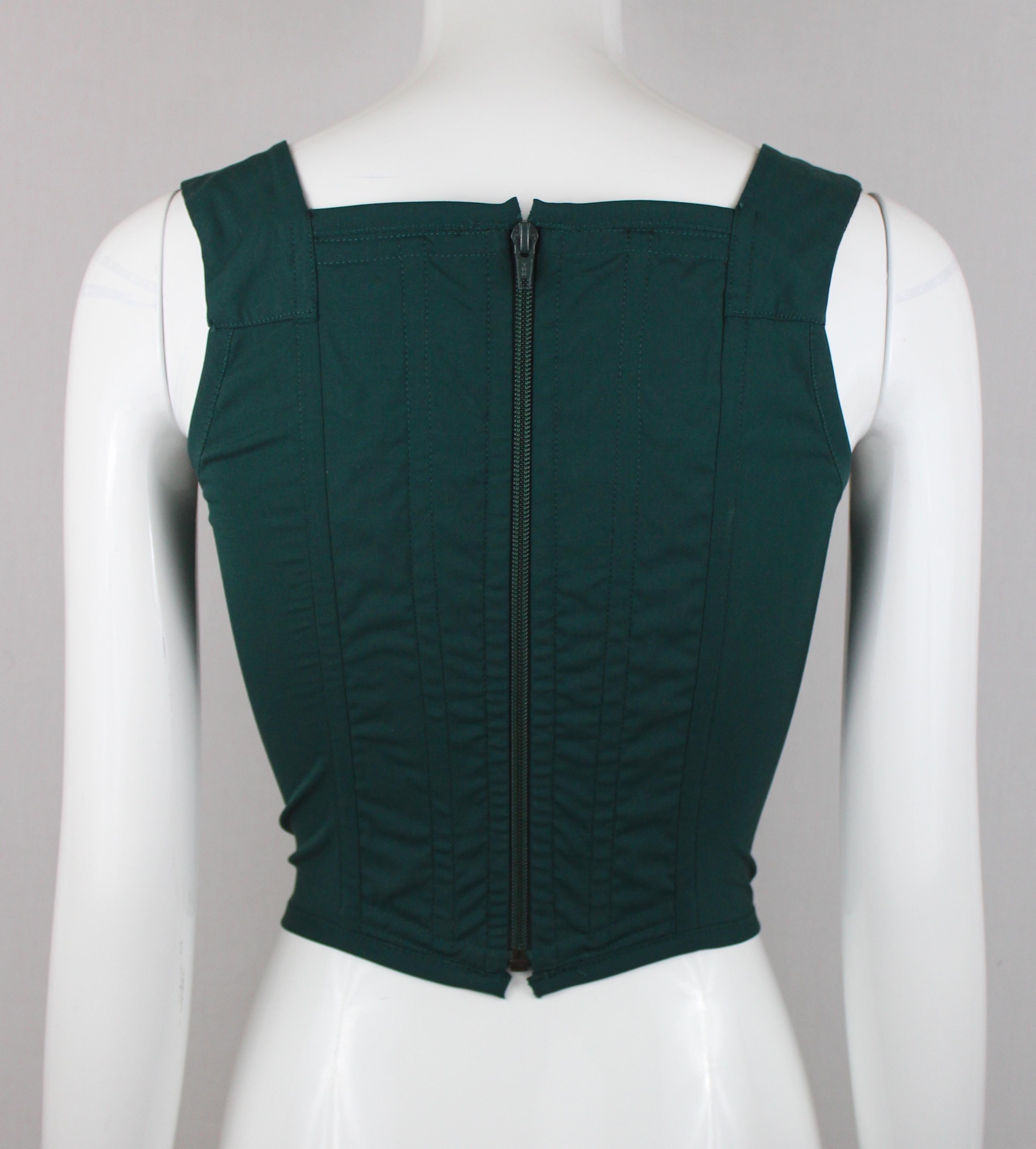 -Gorgeous corset from Vivienne Westwood, has iconic  orb logo on the breast.
-Dark green color, fabric has stretch
-Made in Italy
-Sized Italian 42, corresponds with a 4/6 US, UK 10. 

Approximate Measurements 
-Total length: 18