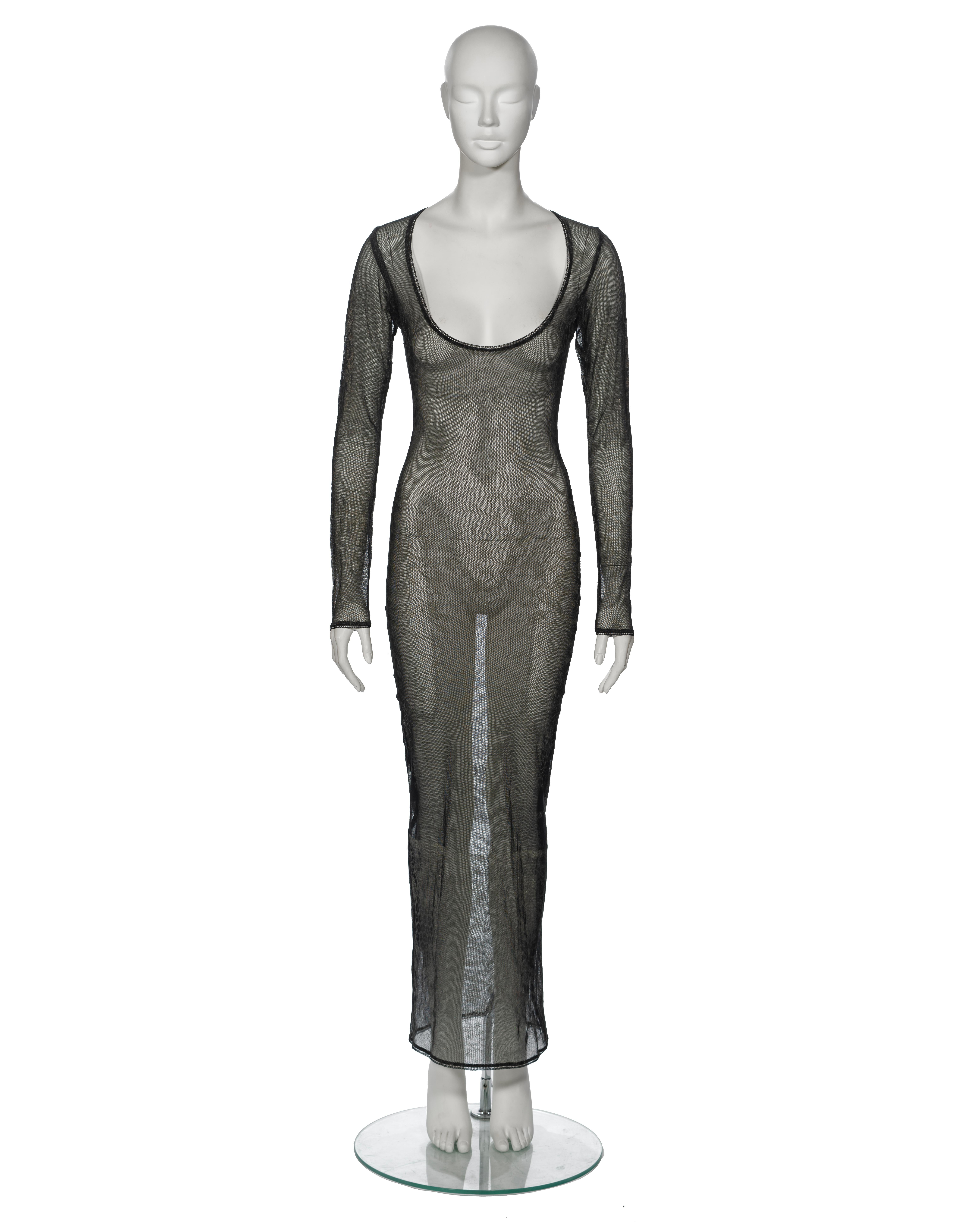 ▪ Archival Vivienne Westwood Evening Dress
▪ Fall-Winter 1992
▪ Sold by One of a Kind Archive
▪ Crafted from a sheer stretch cotton mesh
▪ Features a glitter-printed 17th-century tape lace motif, designed to evoke an antique aesthetic
▪ Showcases a