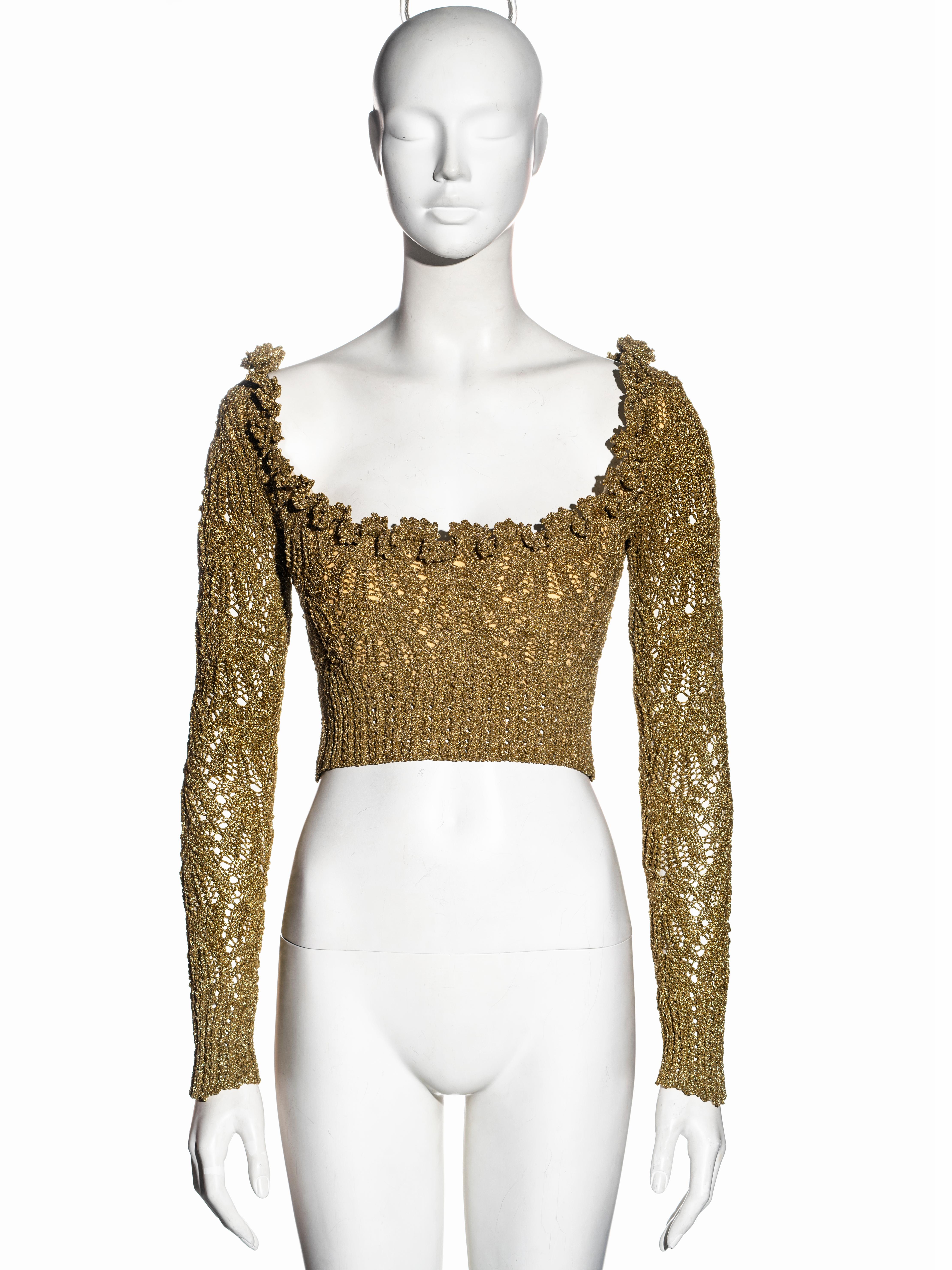 ▪ Vivienne Westwood corset 
▪ Gold crocheted lurex yarn
▪ Built-in boned corset
▪ Long sleeves 
▪ Wide neckline 
▪ Cropped length
▪ Size Medium
▪ Fall-Winter 1993
▪ Made in England