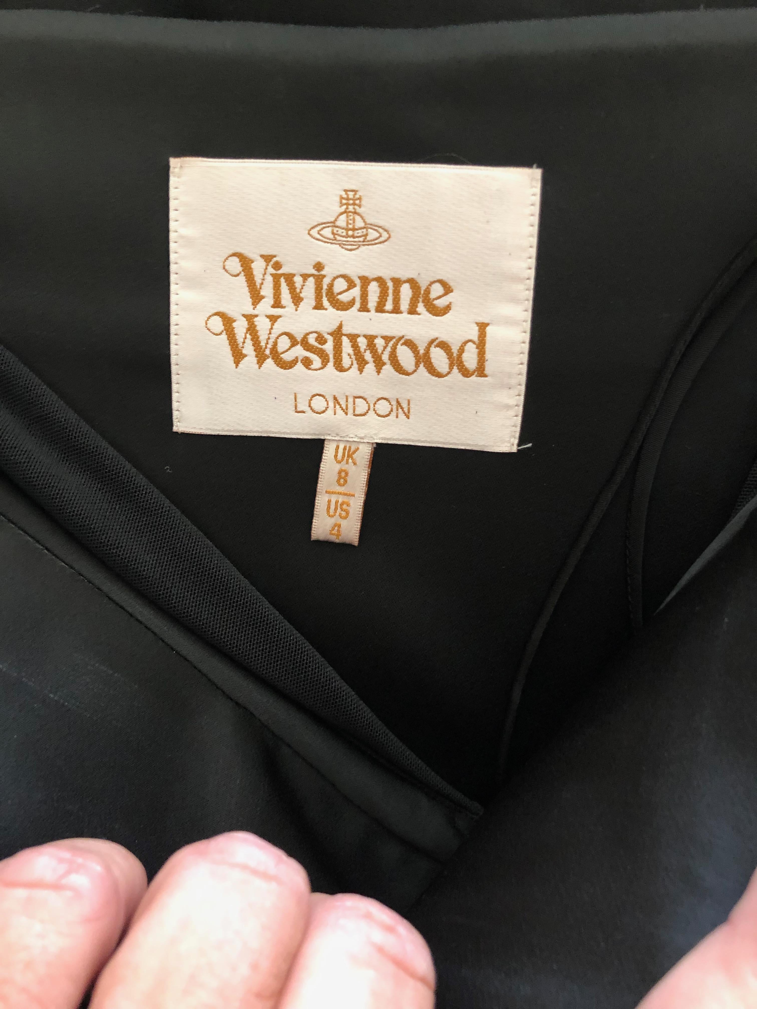 Vivienne Westwood Gold Label  Black Evening Dress with Built In Corset. 
 Built in corset, a Westwood signature.
I'm not certain I styled it right
There is a lot of stretch in the corset, the measurements are given without stretching.
 Size 8 UK, 4