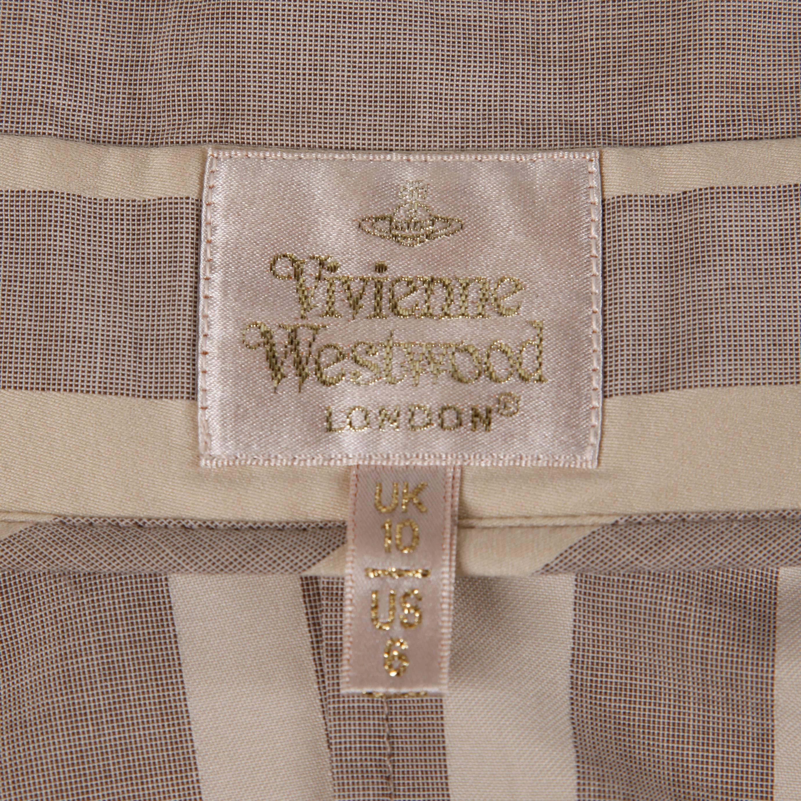 Chic gray and beige striped button up blouse by Vivienne Westwood! Avant garde neck and shoulder cut and rarer gold label. Love the logo embossed on the top button!

Details: 

Unlined
Button Front Closure
Marked Size: UK 10/ US 8
Color: Gray/
