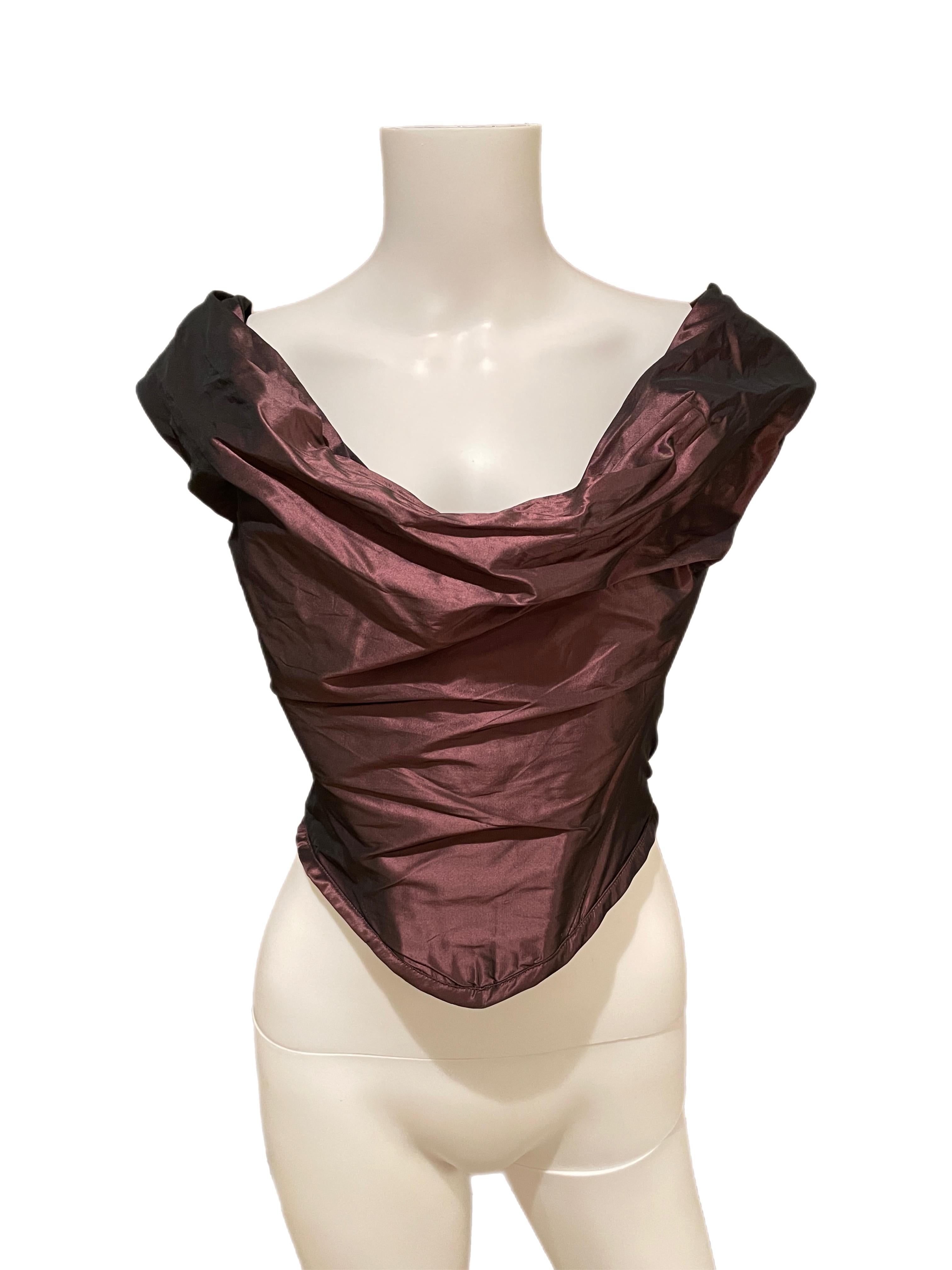 Vivienne Westwood size II maroon burgundy purple 49% silk bustier corset. Excellent condition. Fits like a S/M. Crazy flattering to the body and the color is incredible. You can make it more off the shoulder or pull it up a bit. I think this corset