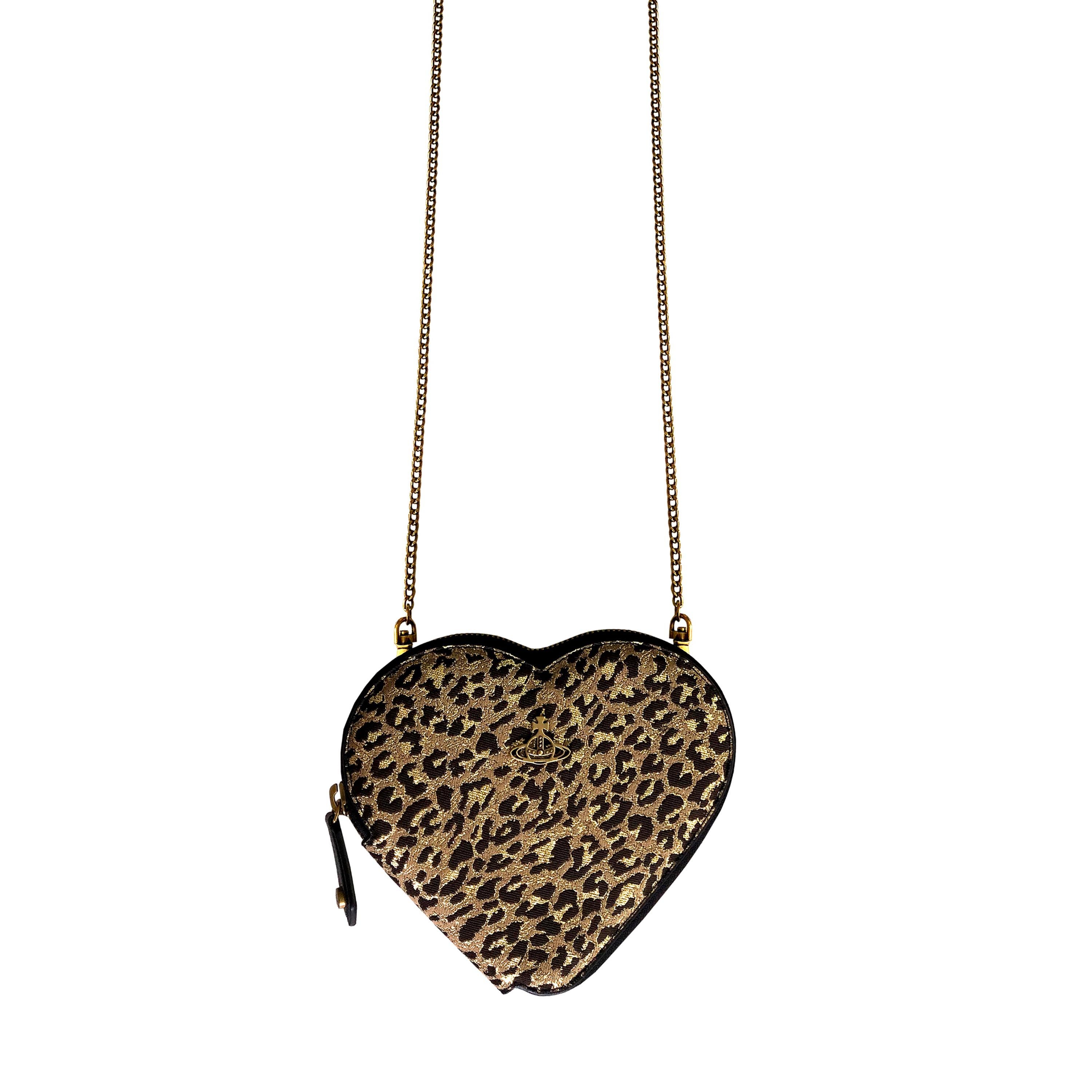 Product Details: Vivienne Westwood - Gold Leopard Jacquard Heart Crossbody Bag - Adjustable / Removable Brass Strap - Vegan - NEW With Tags - Spacious Interior - Satin ‘Orb’ Print Inner Lining - Etched ‘Orb’ Brass + Leather Outer Zip Pull