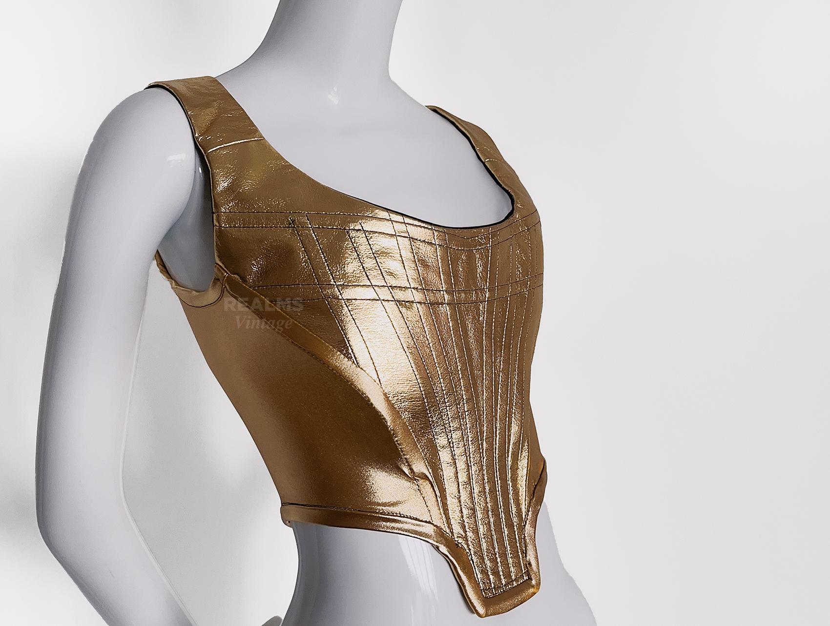 

Vivienne Westwood gold metallic corset. Masterfully constructed famous Westwood signature piece. Assuming Spring Summer Collection 1993. Shimmering gold colour, stunning piece of Fashion History.

Vivienne Westwood
Red Label
marked vintage size