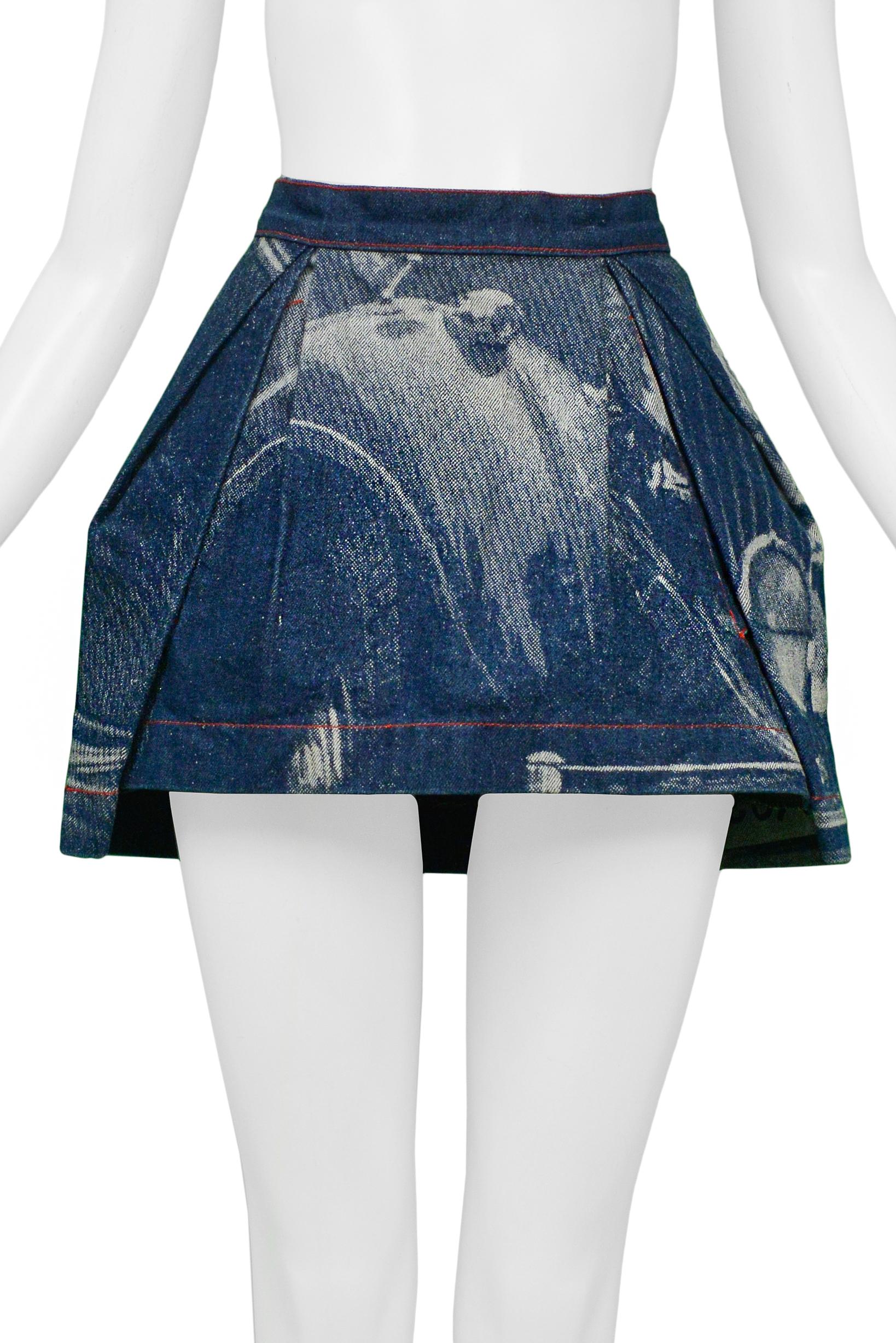Resurrection Vintage is excited to present a vintage Vivienne Westwood denim mini skirt featuring the designer's iconic Rolls Royce photo print, front pleats, red contrasting stitching, center back zipper, and snap. From the 
