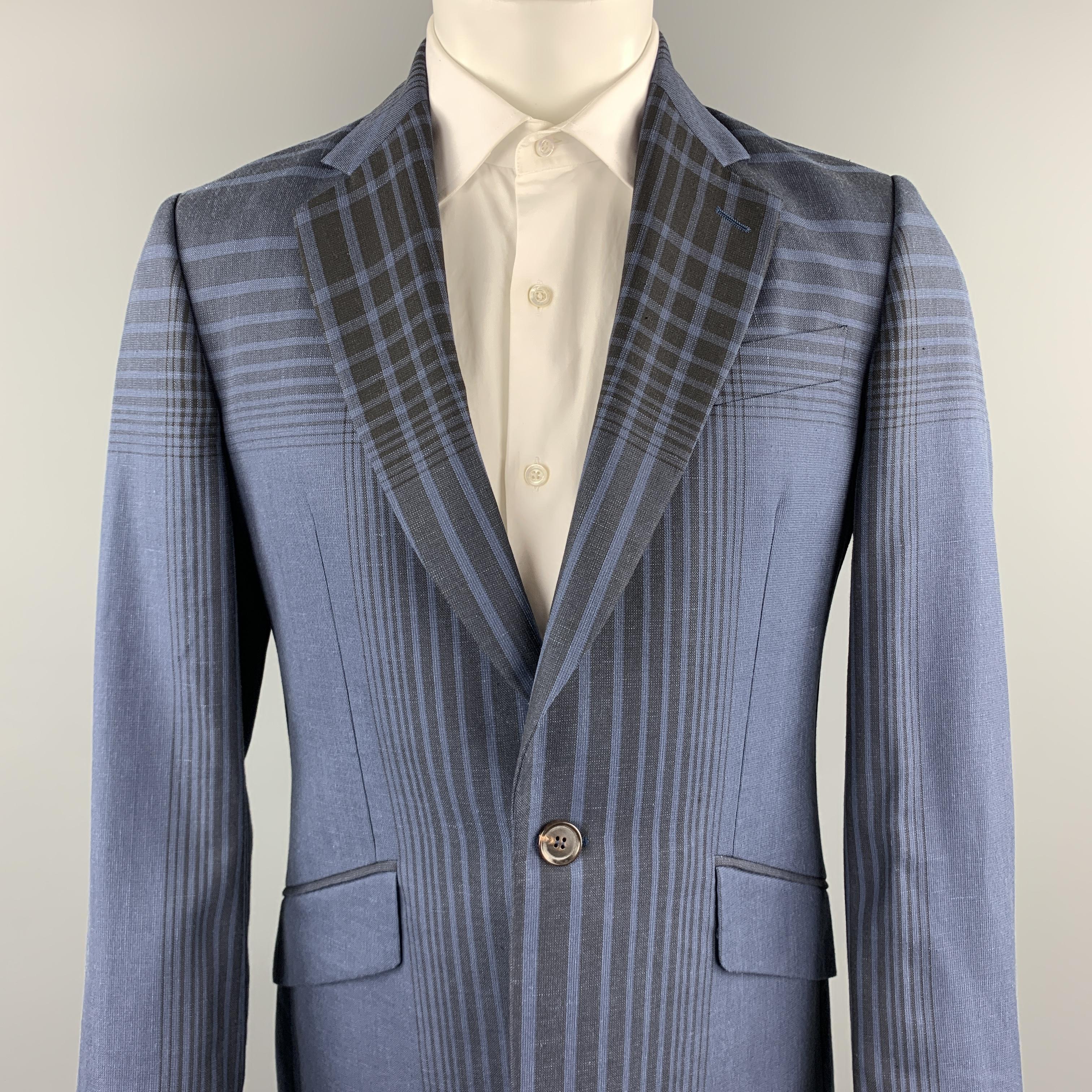 VIVIENNE WESTWOOD MAN sport coat comes in a navy plaid wool blend featuring a notch lapel, flap pockets, and a single button closure. Made in Italy.

Excellent Pre-Owned Condition.
Marked: IT 50

Measurements:

Shoulder: 17.5 in.
Chest: 39