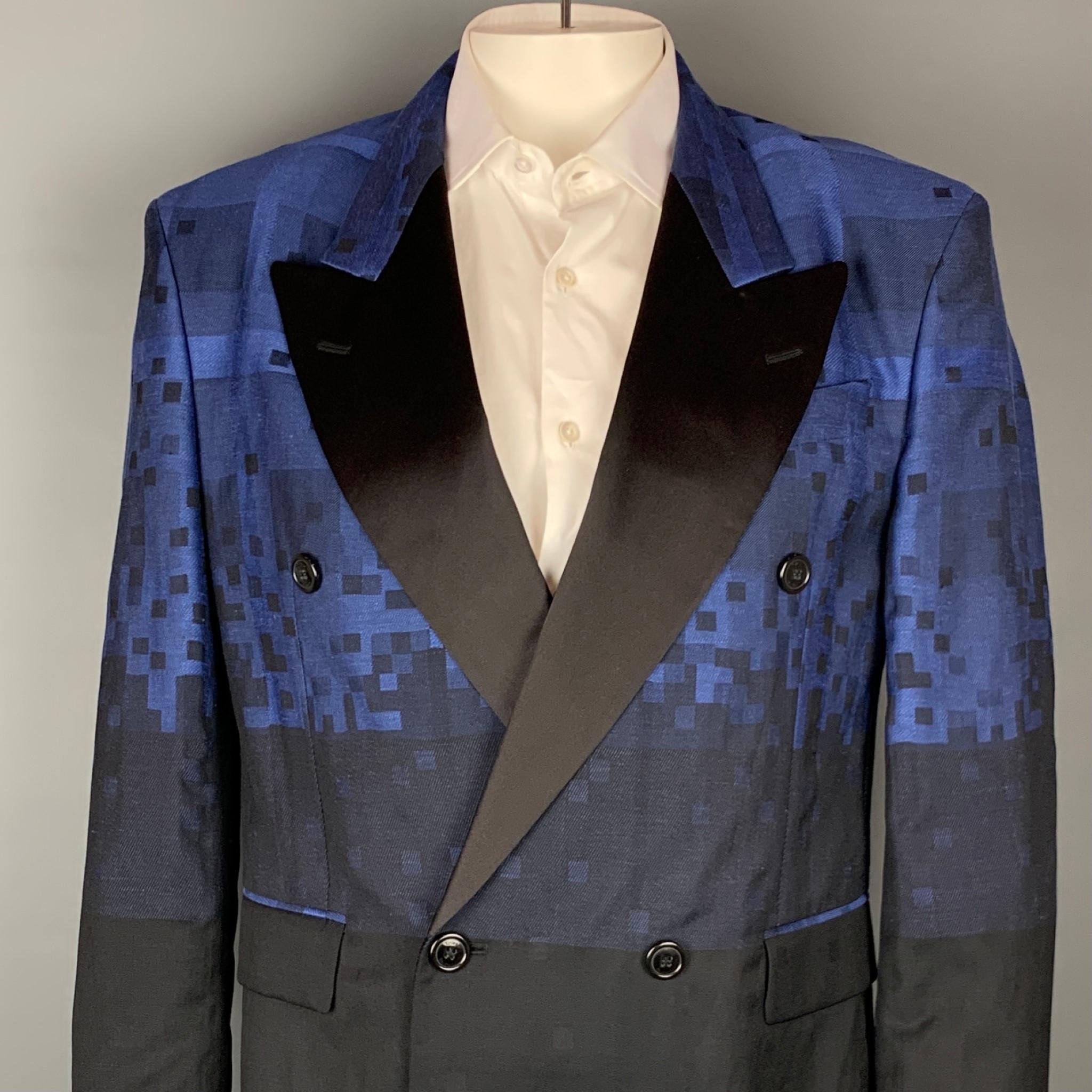 VIVIENNE WESTWOOD MAN sport coat comes in a blue & black square print wool blend with a half liner featuring a peak lapel, raw edge hem, shoulder pads, flap pockets, and a double breasted closure. Made in Italy.

Excellent Pre-Owned