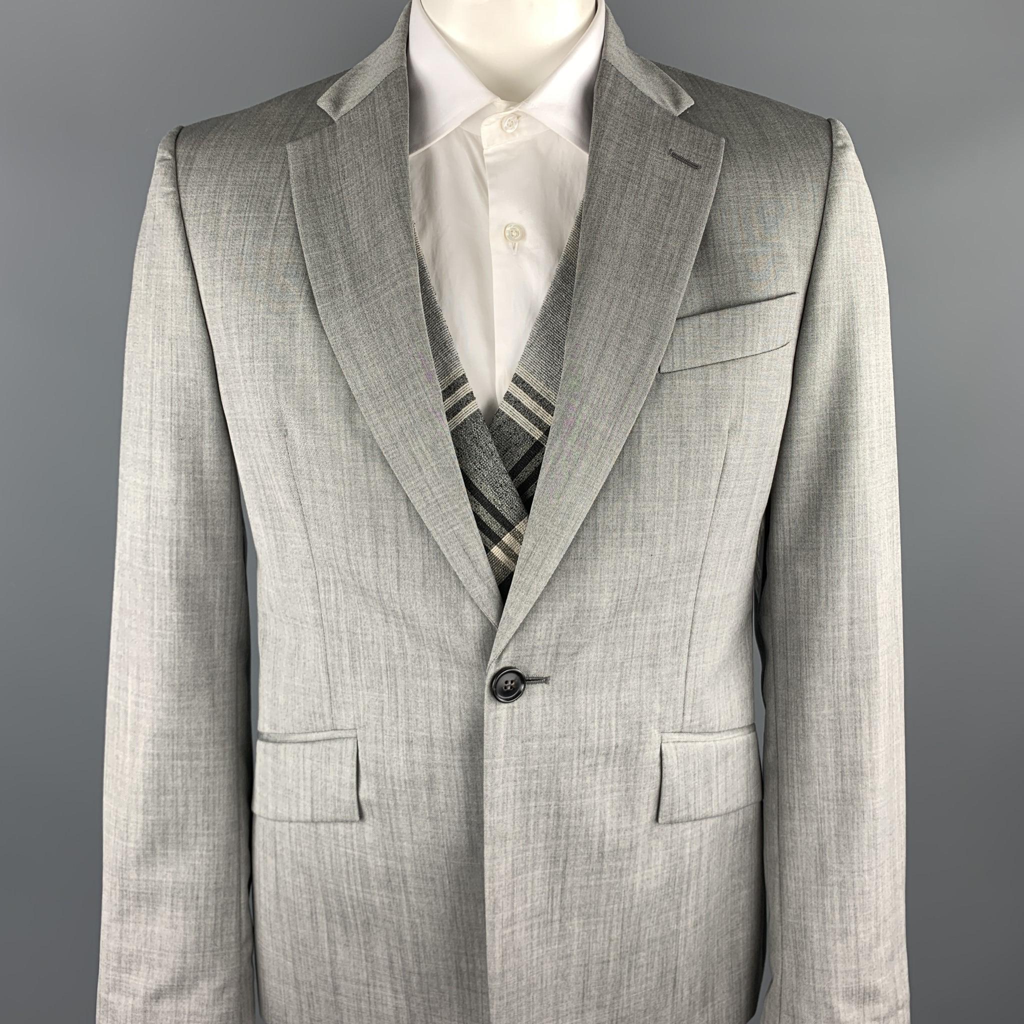 VIVIENNE WESTWOOD MAN sport coat comes in a gray wool featuring a regular slim fit, notch lapel, plaid simulated vest layer, flap pockets, and a single button closure. Made in Italy.

Excellent Pre-Owned Condition.
Marked: IT