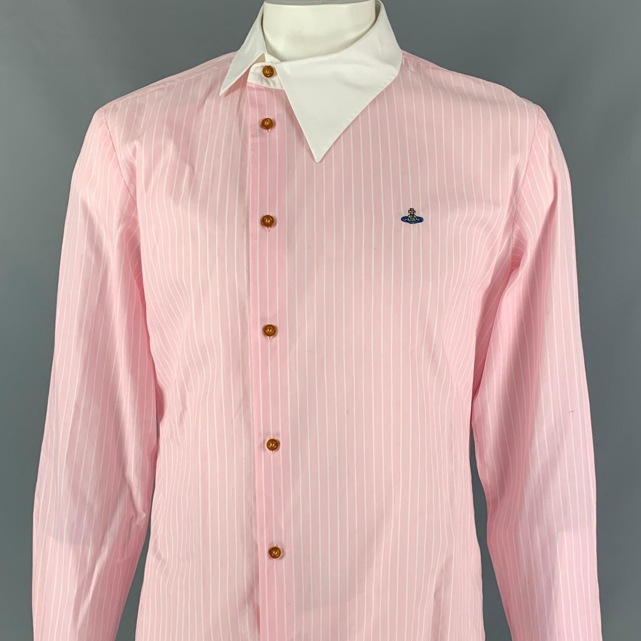 VIVIENNE WESTWOOD MAN long sleeve shirt comes in a pink & white stripe cotton featuring a embroidered logo, asymmetrical collar design, and a buttoned closure. Made in Italy.

Very Good Pre-Owned Condition.
Marked: VI

Measurements:

Shoulder: 19