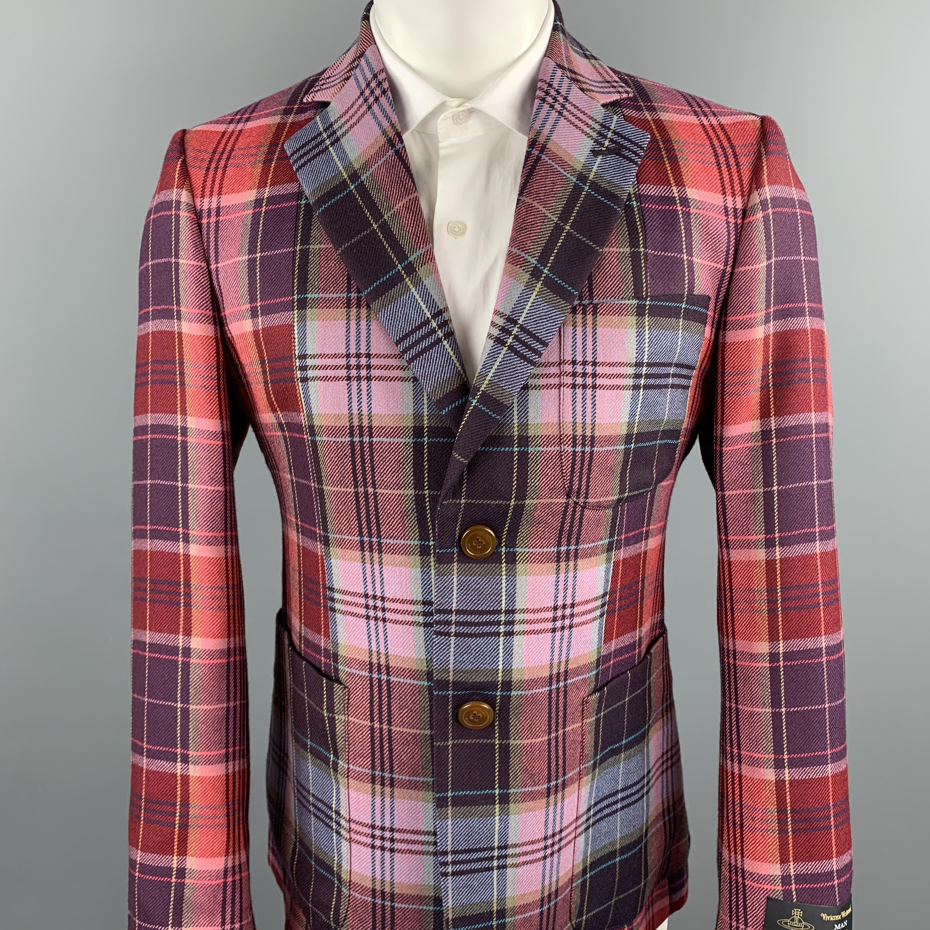 VIVIENNE WESTWOOD MAN sport coat comes in a multi-color plaid wool featuring a notch lapel, patch pockets, and a two button closure. Made in Italy.
Retail Price- $1600
Excellent Pre-Owned Condition.
Marked: IT 50

Measurements:

Shoulder: 17.5 in.