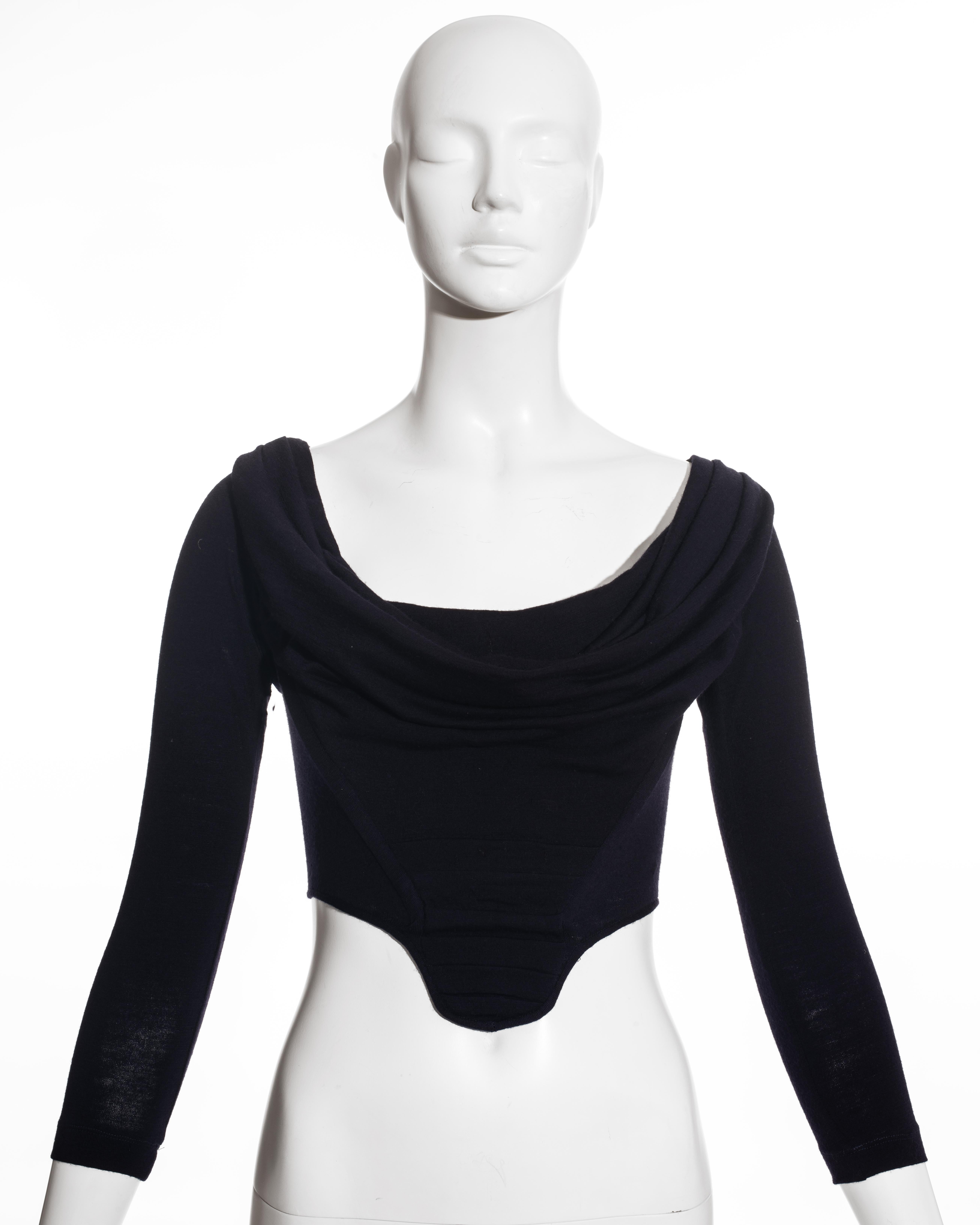 Vivienne Westwood navy blue wool long sleeve corset with pleated bodice and draped neckline. Internal boning designed to cinch the waist and push the breasts up. 

Time Machine, Spring-Summer 1988