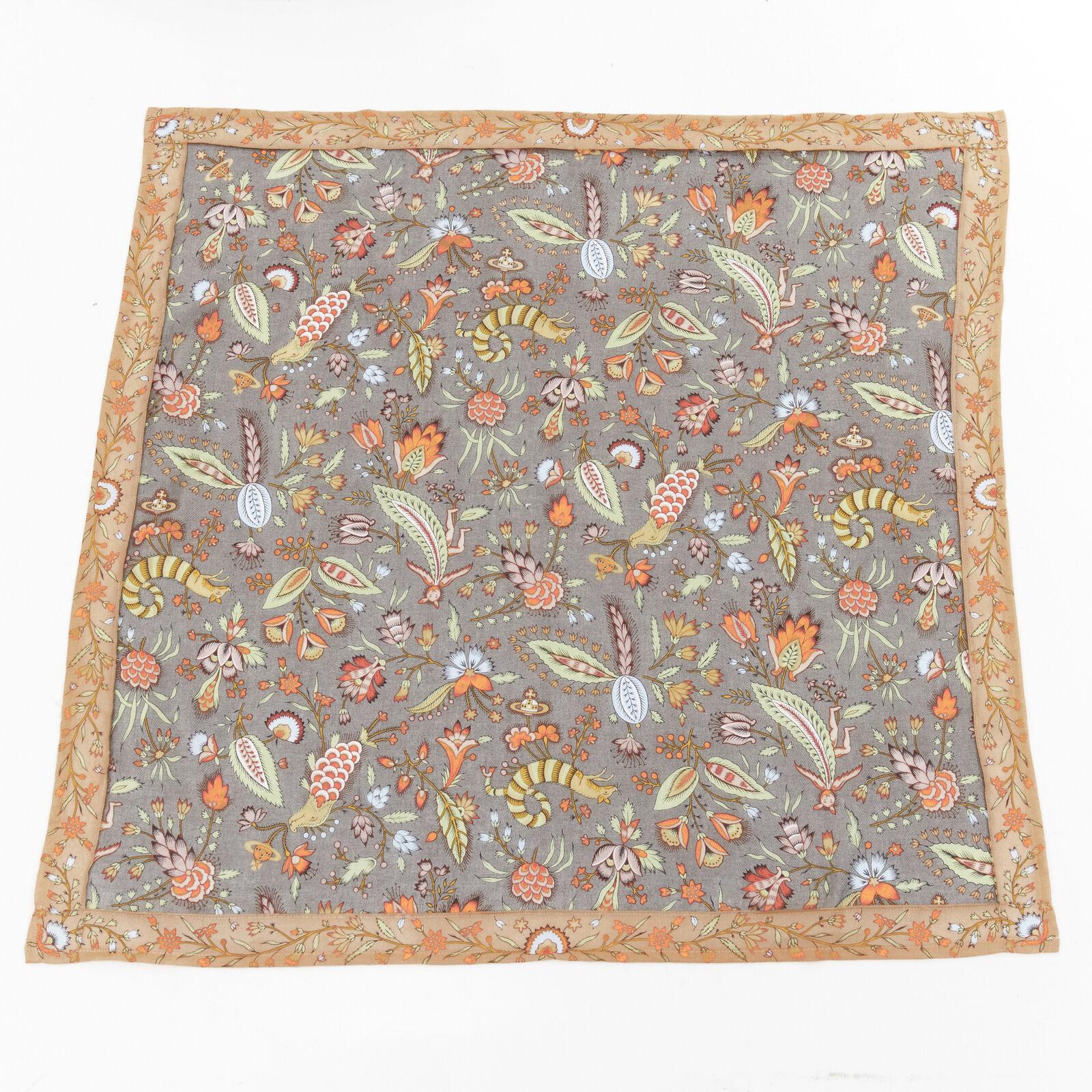 VIVIENNE WESTWOOD orb logo mythical creatures floral handkerchief neckscarf
Reference: CRTI/A00728
Brand: Vivienne Westwood
Material: Cotton
Color: Grey, Orange
Pattern: Floral

CONDITION:
Condition: Excellent, this item was pre-owned and is in