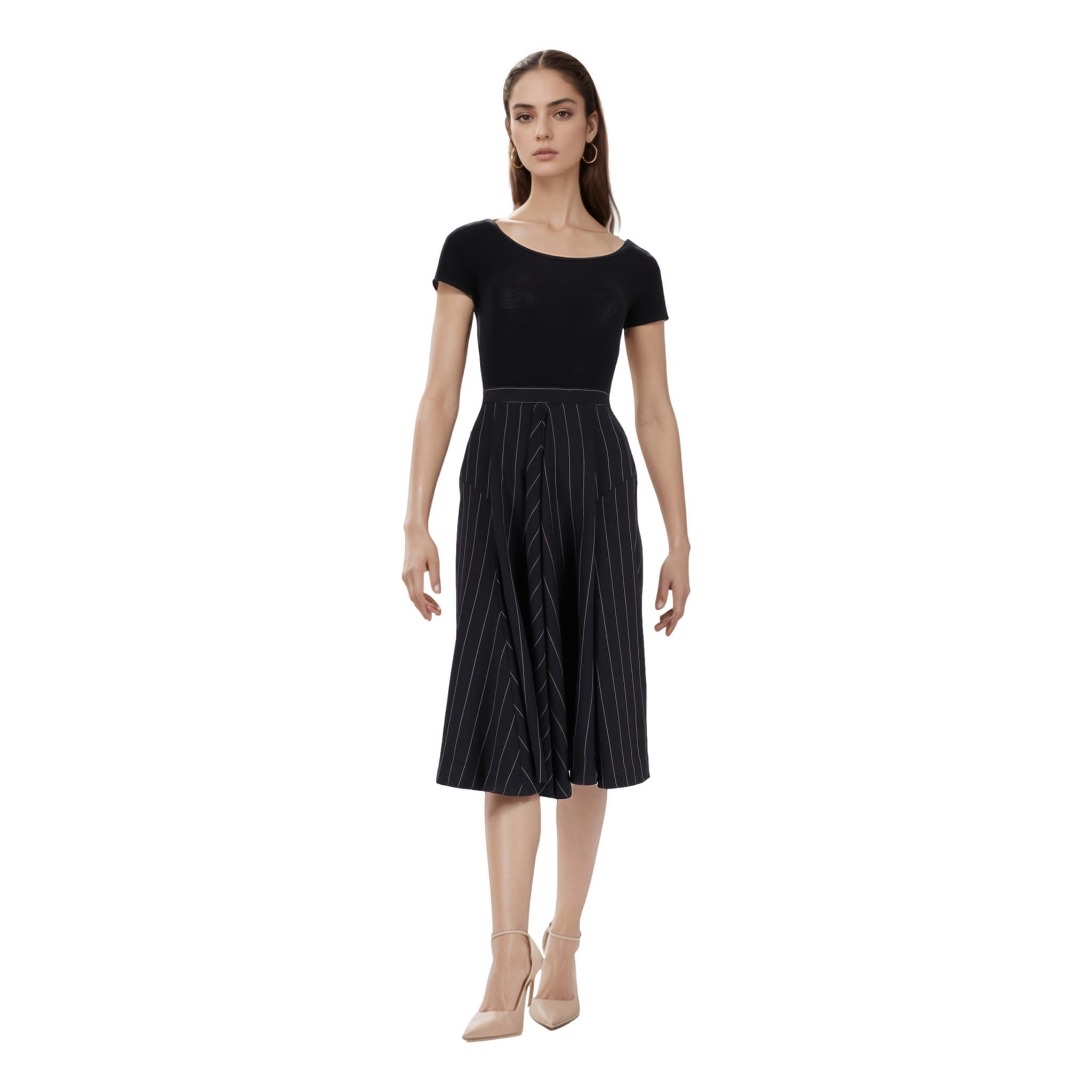 Vivienne Westwood Pin Stripe Wool Skirt

From the Red Label Range - Black midi pleated skirt fully crafted from wool and designed with pin stripe pattern.

Featuring flared design, high waist and logo engraved button closure to rear.

Rrp Approx.
