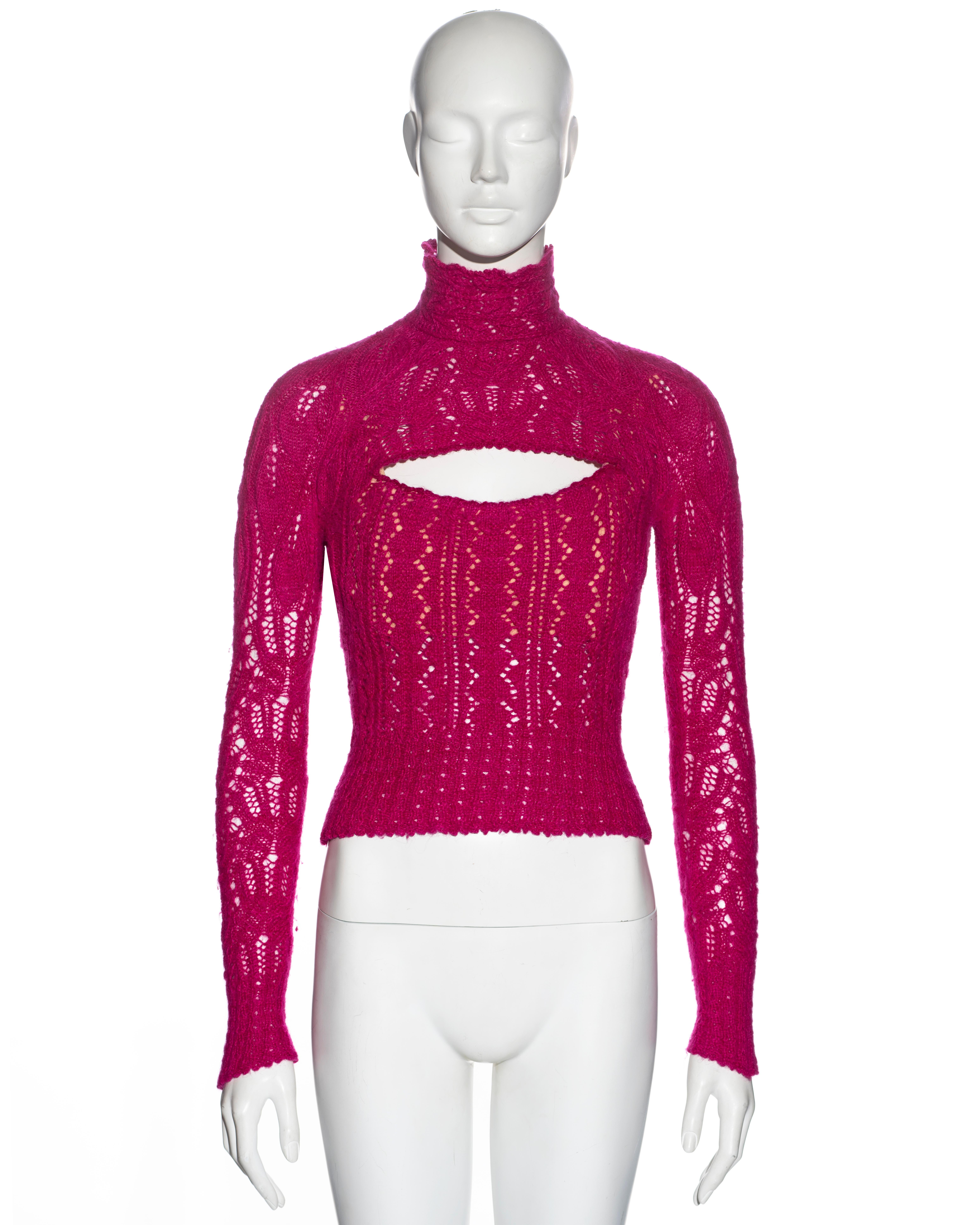 ▪ Vivienne Westwood rare knitted corset sweater 
▪ Sold by One of a Kind Archive 
▪ Constructed from knitted pink Angora 
▪ Nude internal corset producing a pronounced décolletage
▪ Opening at the breast line 
▪ High neck 
▪ Long fitted sleeves 
▪