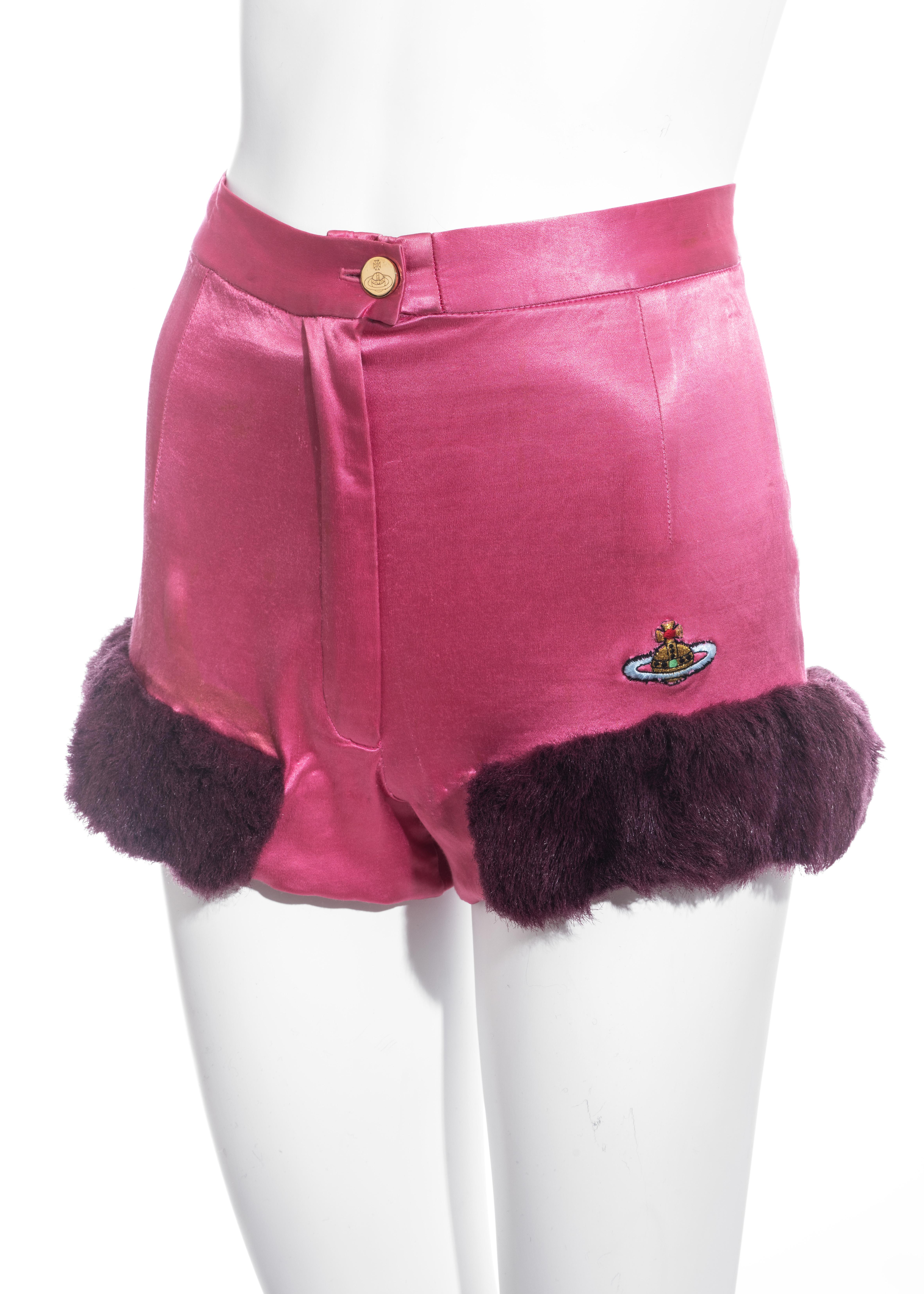▪ Vivienne Westwood pink satin mini shorts / hot pants
▪ Purple faux fur trim 
▪ Embroidered Orb logo 
▪ Gold orb button 
▪ Zip-up fly 
▪ UK 12 - FR 40 - US 8
▪ Fall-Winter 1991