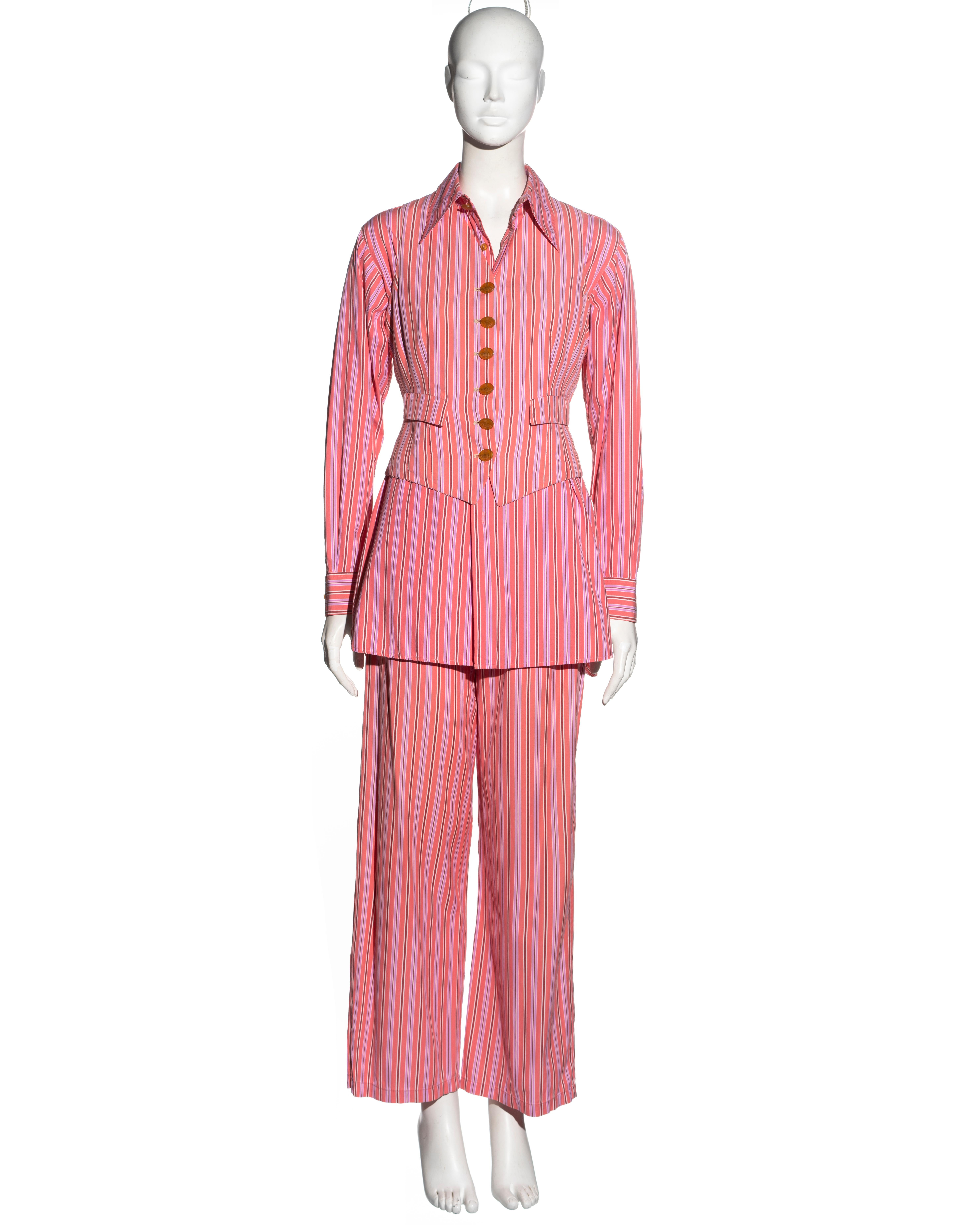 ▪ Vivienne Westwood 3-piece suit
▪ Sold by One of a Kind Archive
▪ Constructed from salmon pink cotton with burgundy, lilac and white stripes 
▪ Oversized shirt with signature embroidered orb 
▪ Fitted waistcoat with orb-etched buttons 
▪ Wide-leg