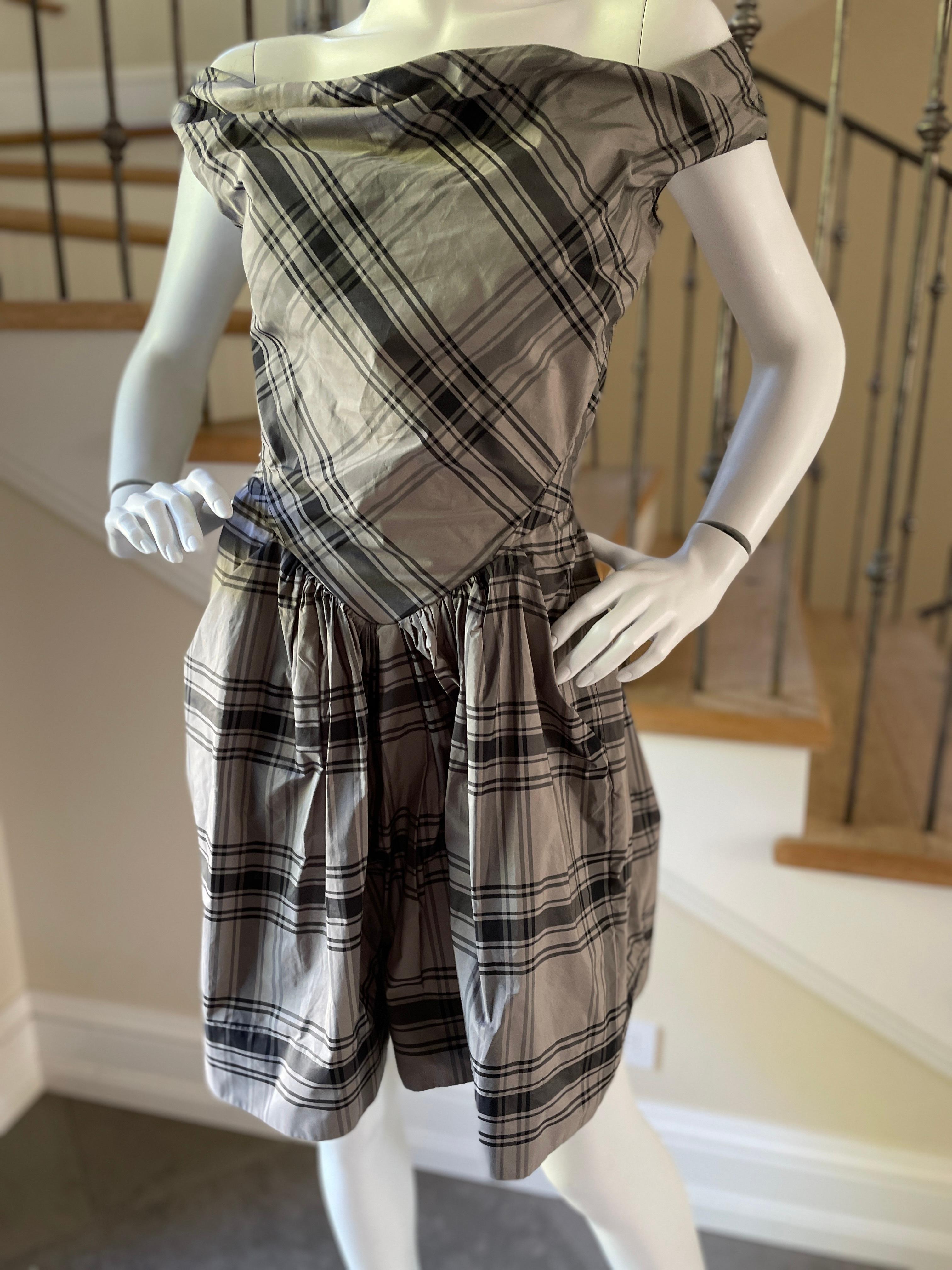 Vivienne Westwood Plaid Taffeta Day Dress for Anglomania.
This is so charming, with a button down front and a wide skirt that is pleated at the waist.
There are pockets.
 Size 42 UK
Bust 36