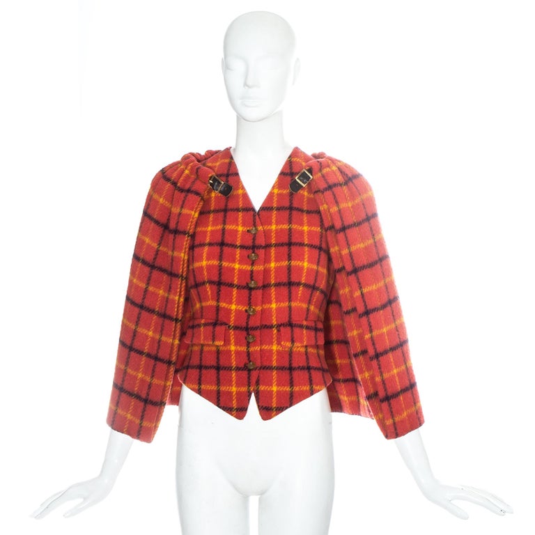 Vivienne Westwood red checked wool waistcoat with caplet detachable leather buckle fastenings.

Fall-Winter 1988