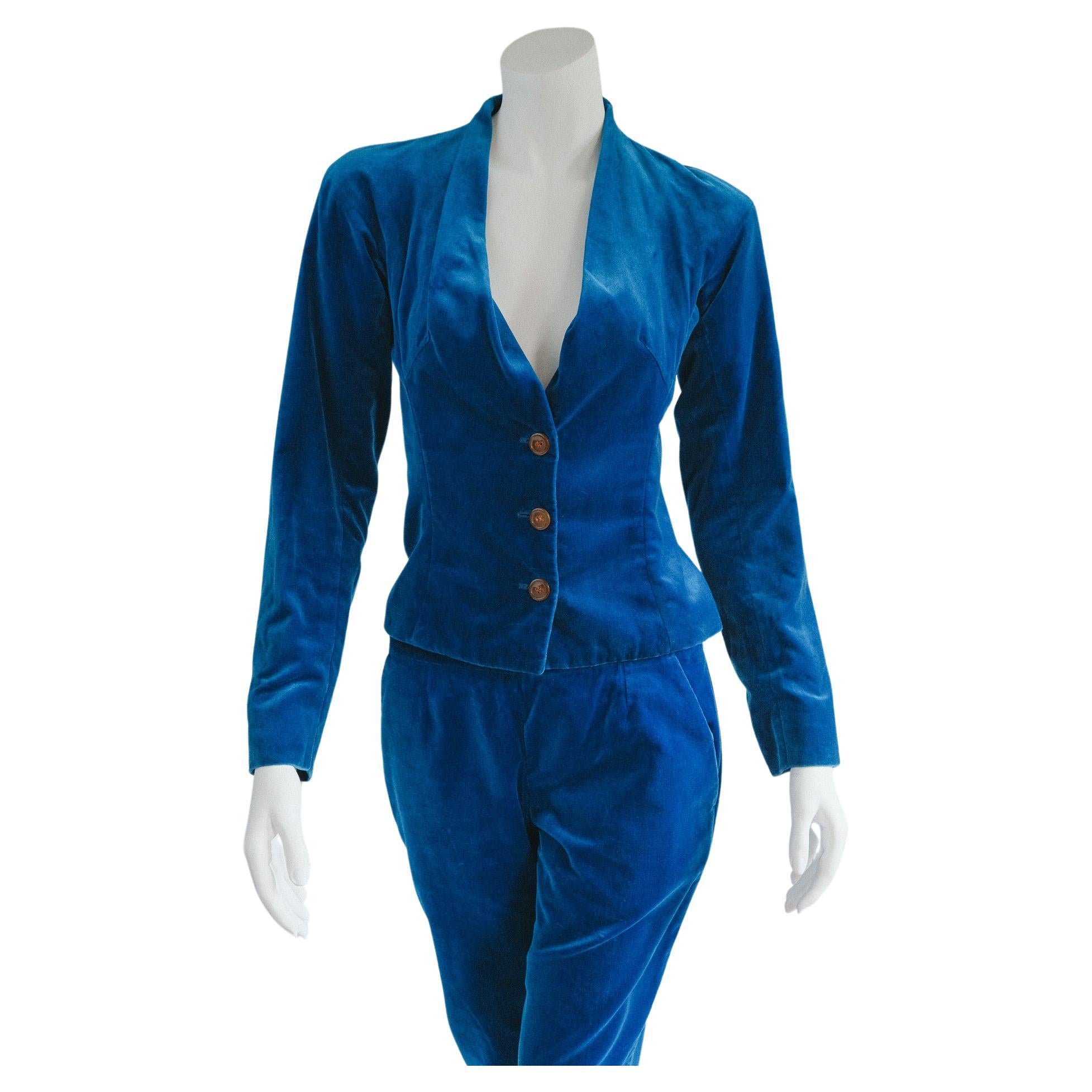 Free Photo  Full length of attractive woman in blue velvet suit with  jacket and trousers
