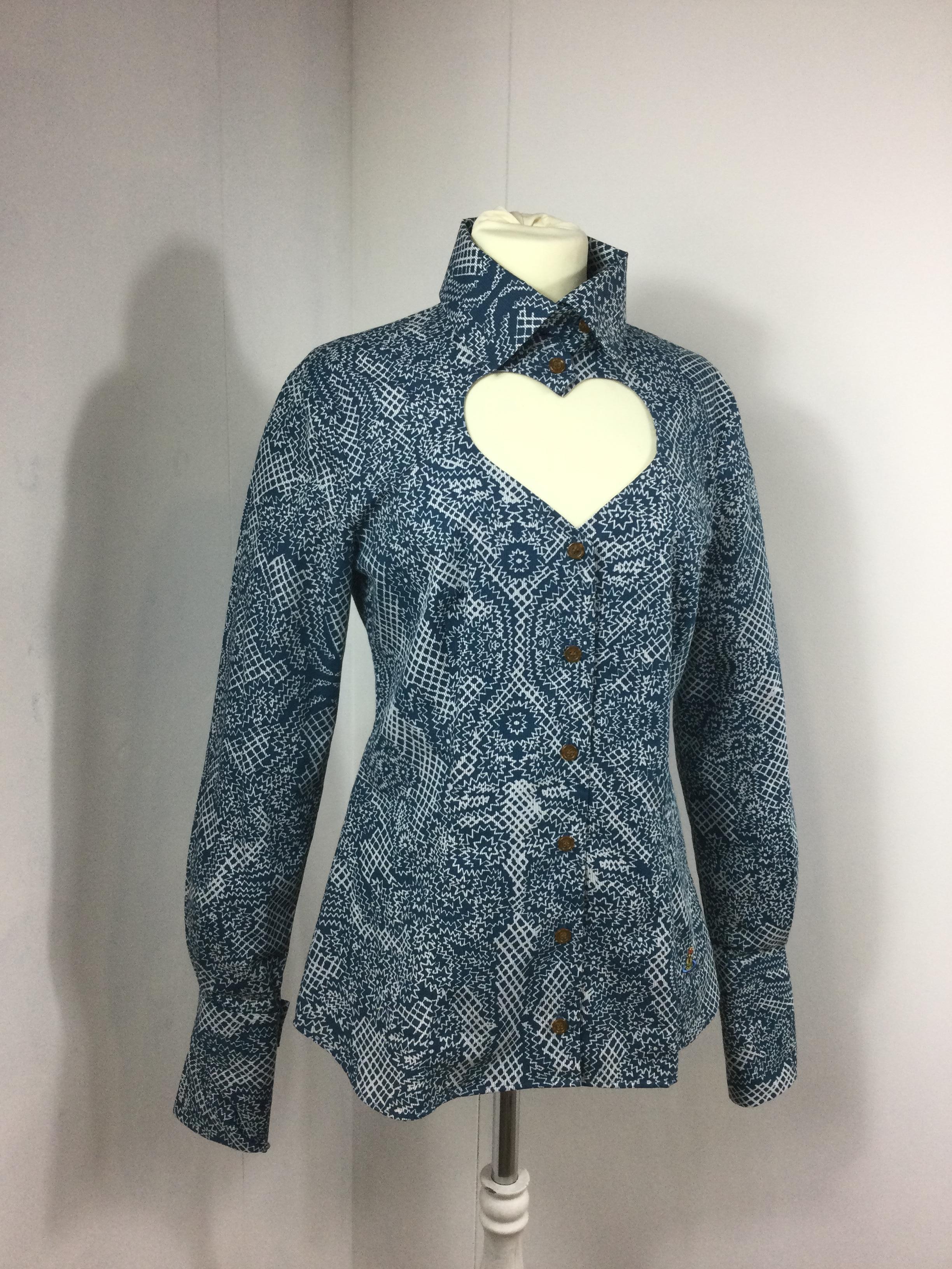 Vivienne Westwood, Red label shirt.
100% cotton. Featuring heart - shape neckline.
Size 42 Italian.
Measurements:
Shoulders 42 cm
Bust 44 cm
Waist 40 cm
Length 75 cm
Sleeves 70 cm 
Conditions: Excellent - Previously owned, like new or lightly worn,