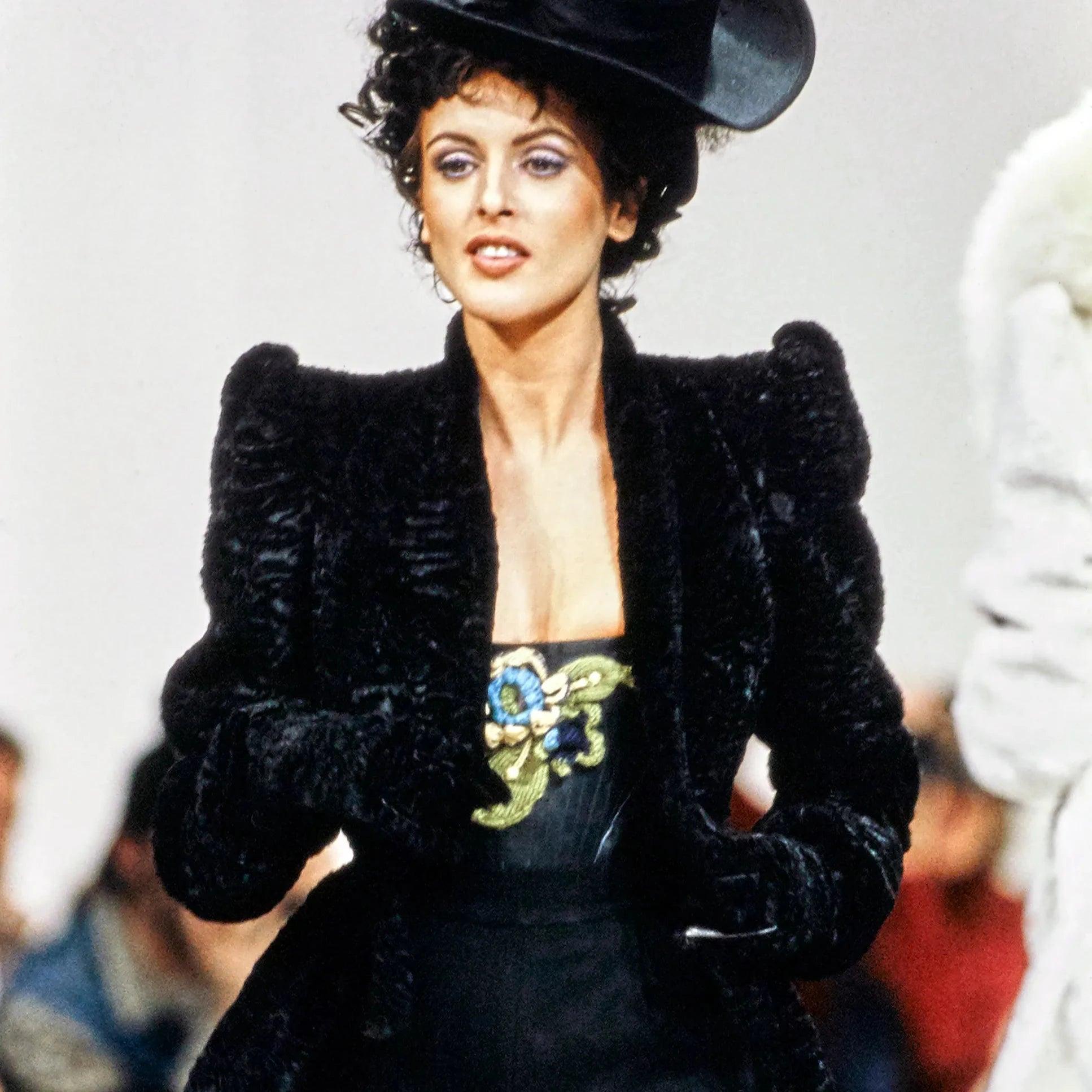 Vivienne Westwood jacket with faux astrakhan fur, leather cuffs, logo-embossed buttons and lining. Back flap detail conceals side pockets. 
 Similarly seen on Fall 1994 runway. 
 Remarks: There is no composition tag. There are some imperfection on
