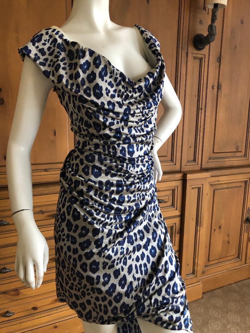 Super sexy draped leopard print dress from Vivienne Westwood Red Label.
There is a full inner corset, see photo's .
There is a lot of stretch in this fabric.
Size S
Bust 32