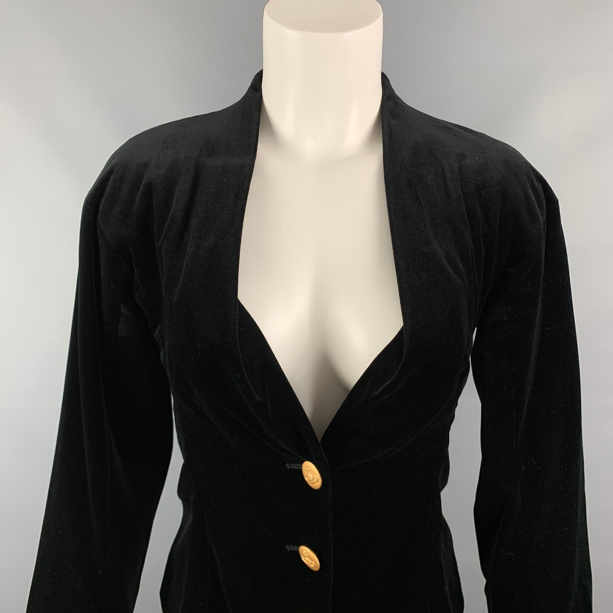 VIVIENNE WESTWOOD RED LABEL jacket comes in a black velvet cotton with a full liner featuring a collarless style and a gold toned buttoned closure. Made in Italy.

Very Good Pre-Owned Condition.
Marked: 40

Measurements:

Shoulder: 17.5 in.
Bust: 34