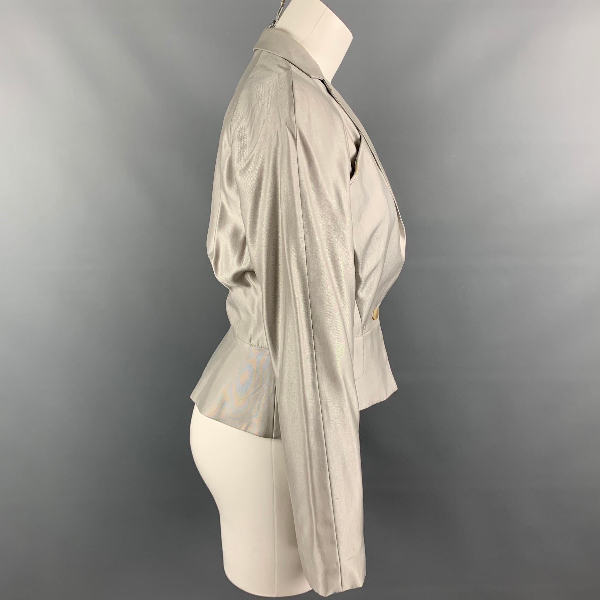 VIVIENNE WESTWOOD RED LABEL jacket comes in a light gray viscose blend with a full monogram print liner featuring a notch lapel, flap pockets, and a single button closure.

Good  Pre-Owned Condition. Minor discoloration at front. 
Marked:
