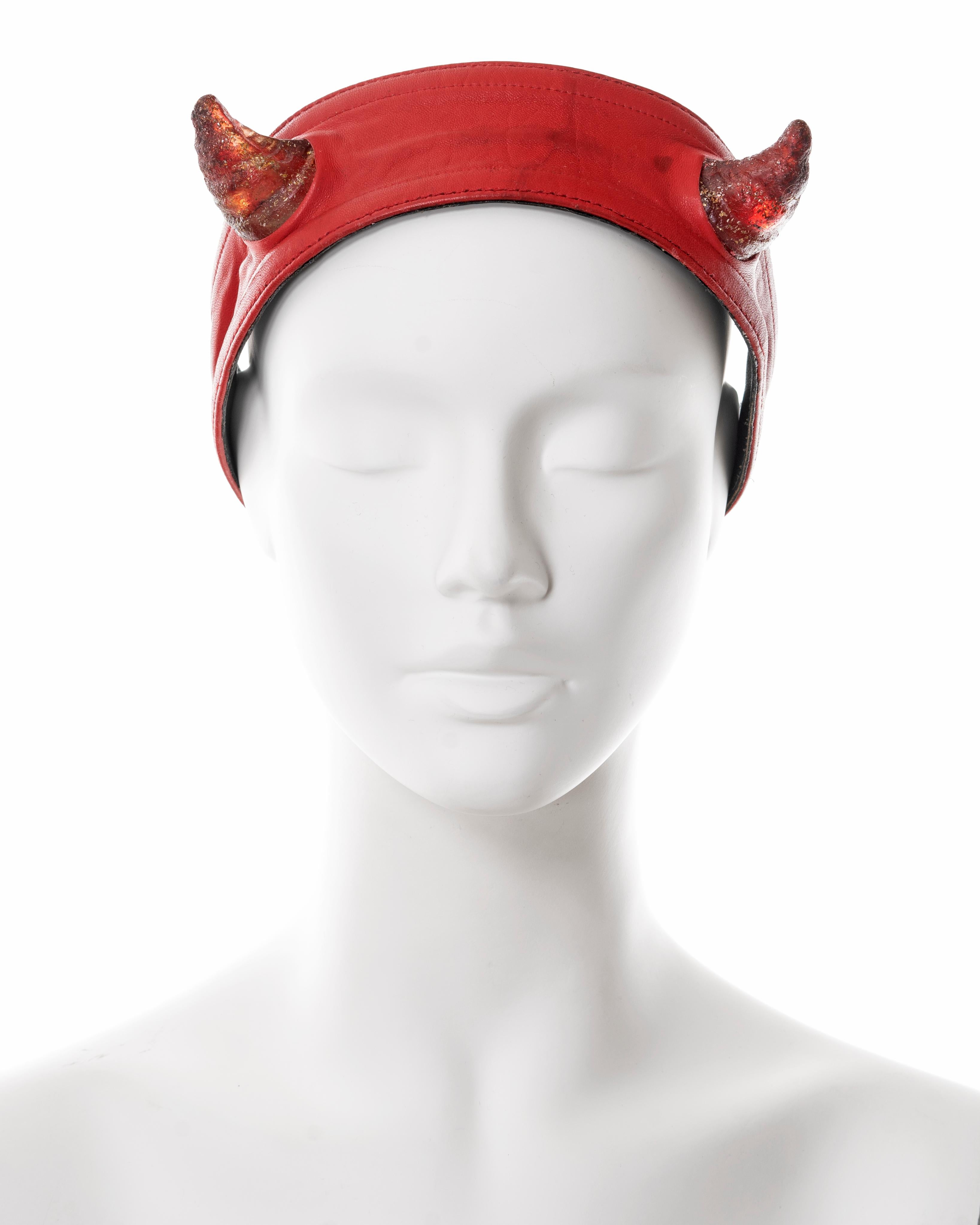 ▪ Vivienne Westwood red leather headband 
▪ Sold by One of a Kind Archive 
▪ 'Britain Must Go Pagan', Spring-Summer 1988
▪ Battery-powered light-up acrylic Satyr horns 
▪ Unlabelled show piece
▪ First seen on the cover of Blitz Magazine, March 1988