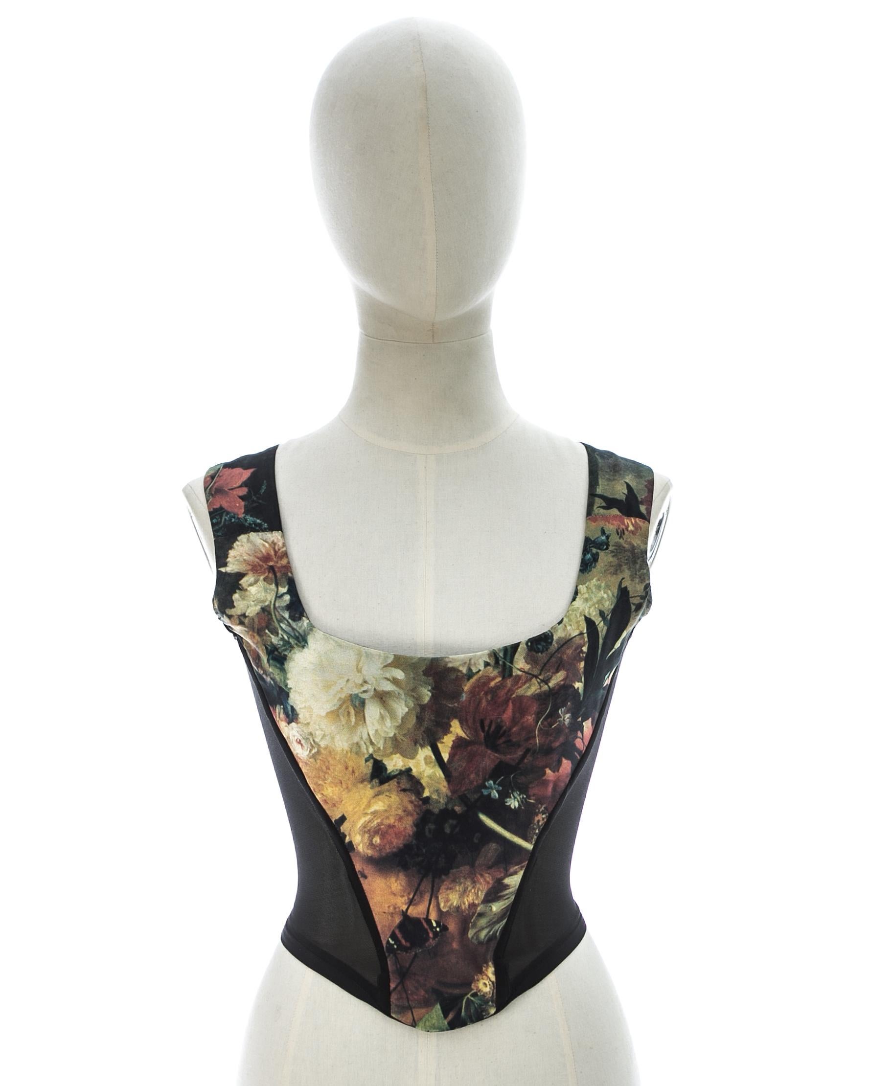 Renaissance floral print corset with black semi-sheer side panels and built-in boning; designed to cinch the waist and push the breasts up.

Fall-Winter 1995