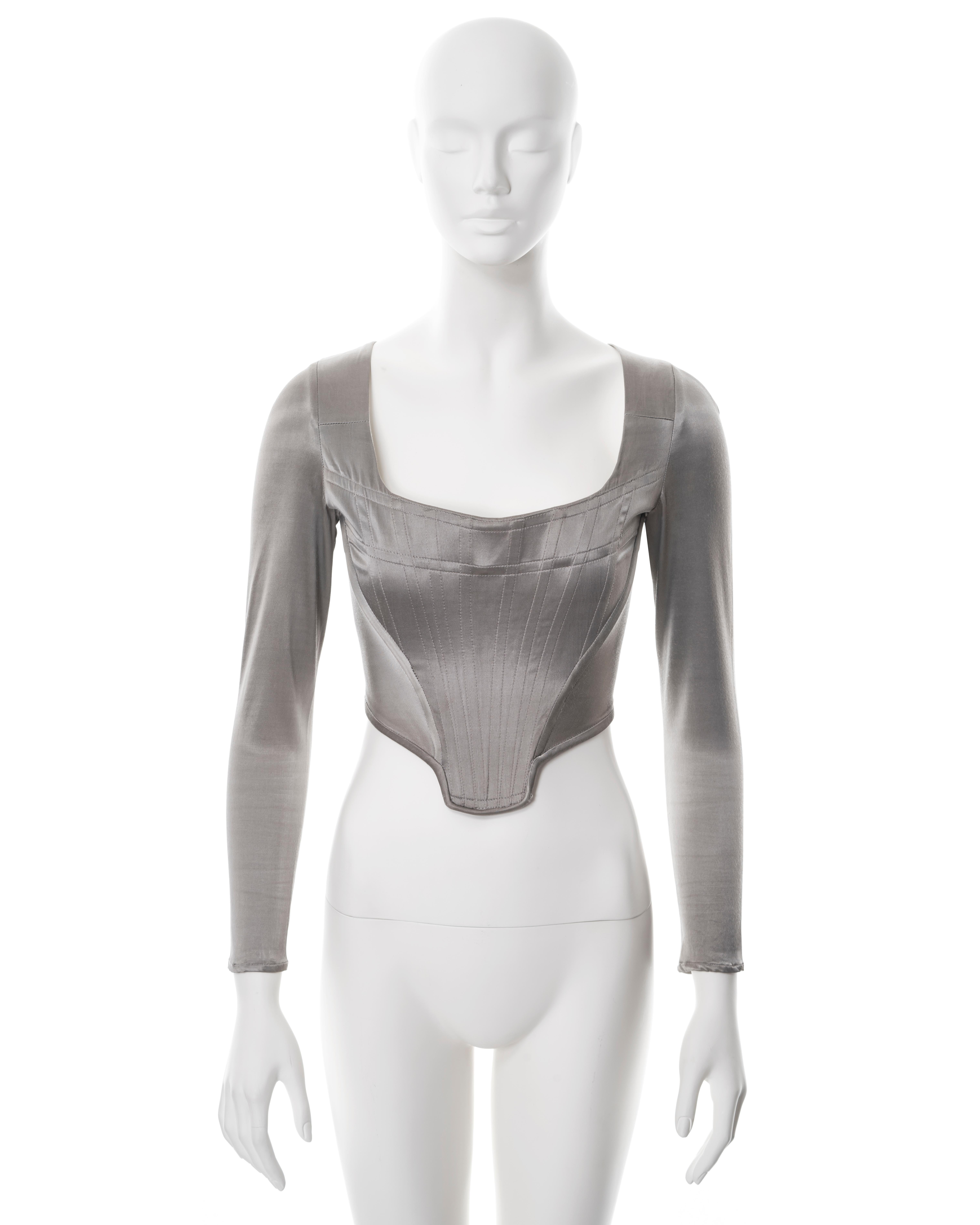 ▪ Vivienne Westwood silver stretch-satin corset
▪ Spring-Summer 1992
▪ Constructed from silver rayon-lycra satin 
▪ Built-in corset boning produces a smaller waist and pronounced décolletage
▪ UK 10 - FR 38 - US 6
▪ Made in England

All photographs