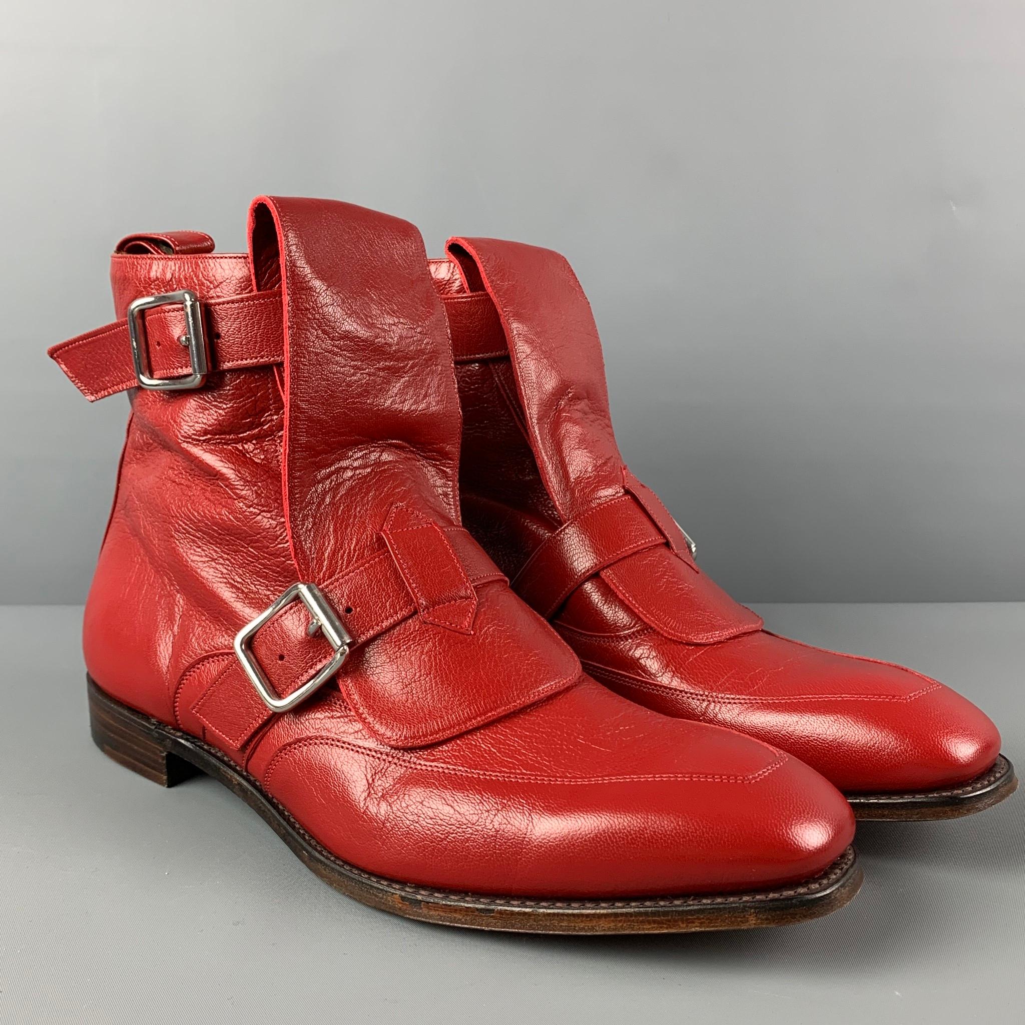 VIVIENNE WESTWOOD ankle boots comes in a red leather featuring a square toe, front flap, double buckle straps, and a lace up closure. Includes box. Made in England. 

Very Good Pre-Owned Condition.
Marked: 11

Measurements:

Length: 12.75 in.
Width: