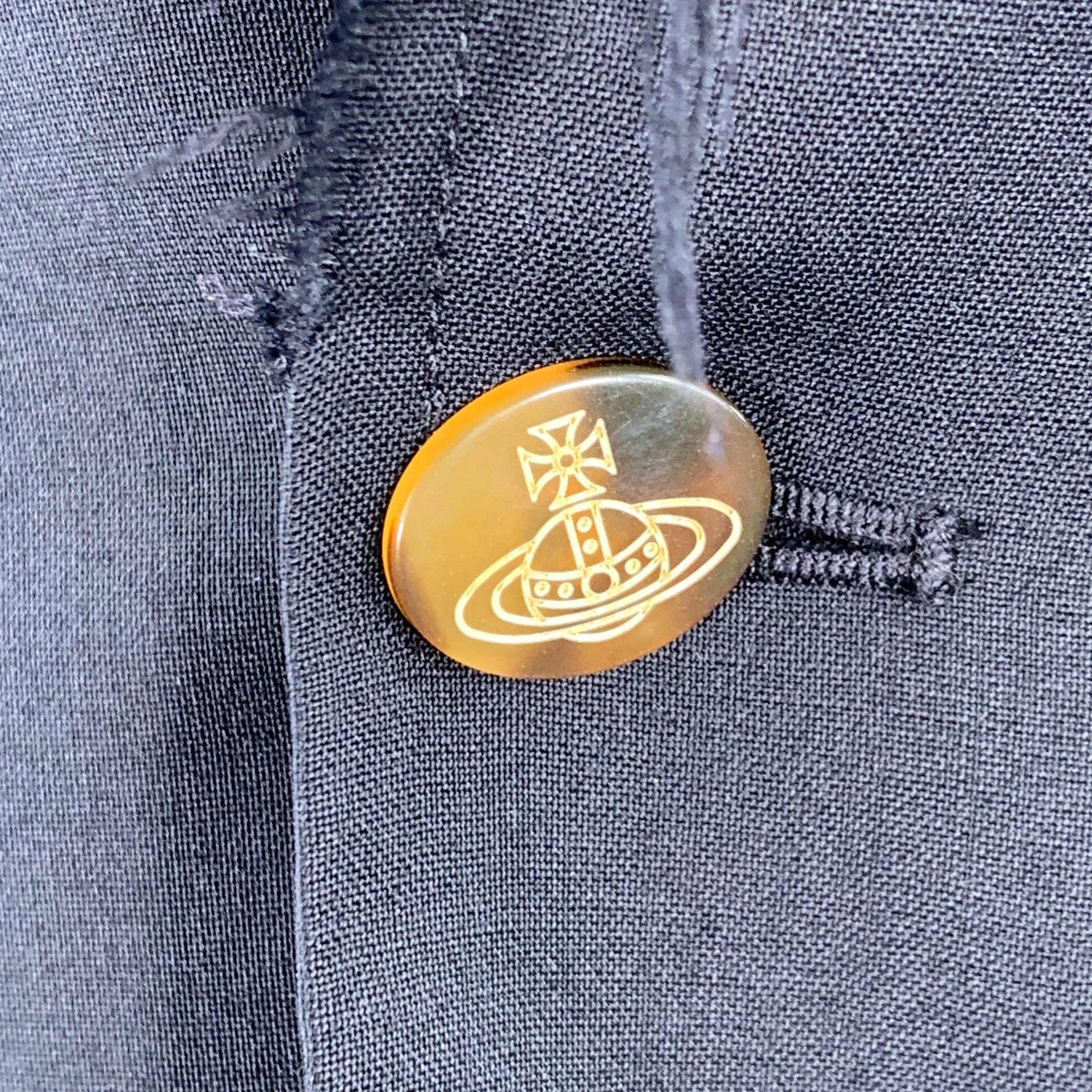 VIVIENNE WESTWOOD sport coat
in a black wool featuring a peak lapel with raw edge details, single vented back, and single signature VW orb button closure. Made in Portugal.Excellent Pre-Owned Condition. 

Marked:   IT 46 

Measurements: 
 
Shoulder: