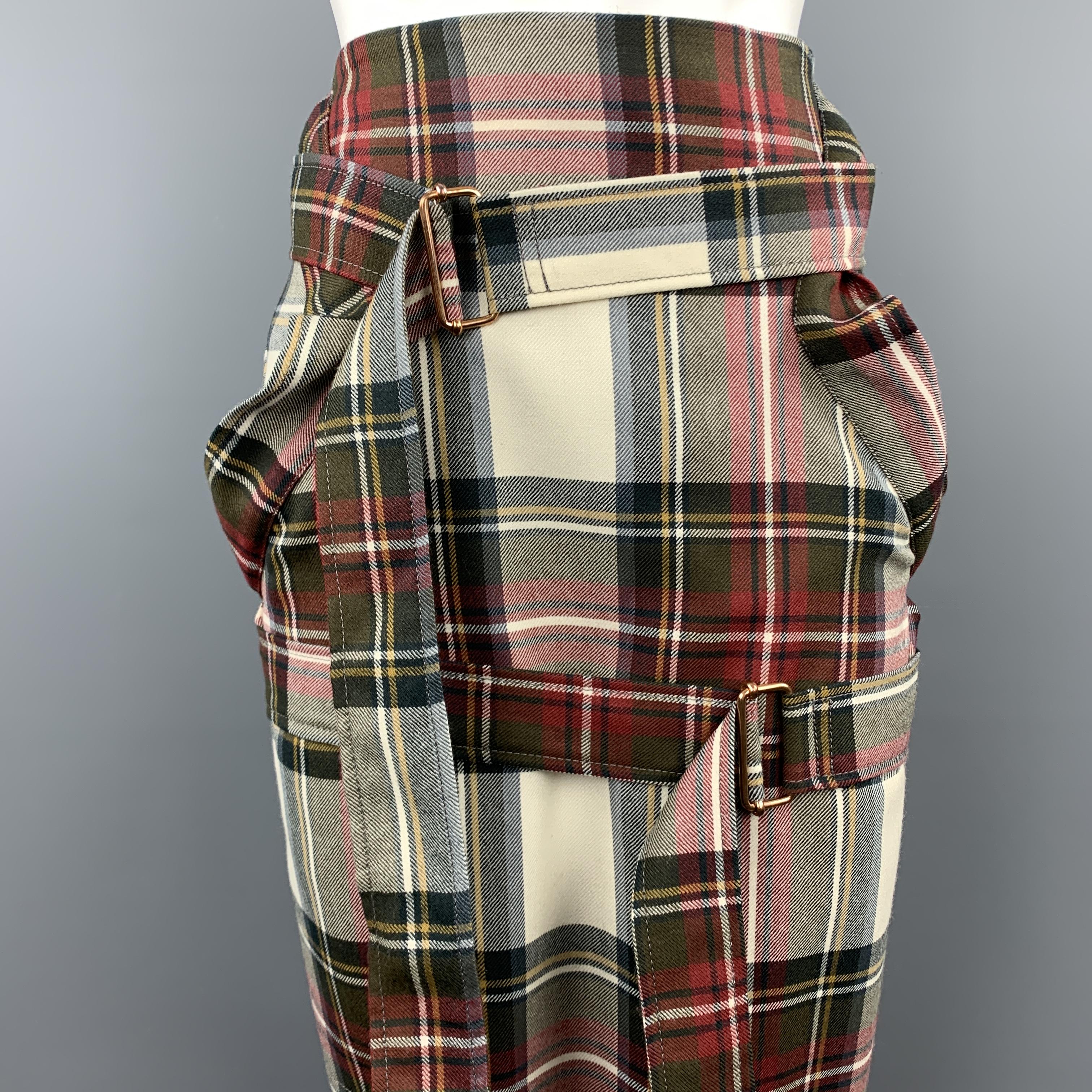 VIVIENNE WESTWOOD ANGLOMANIA skirt comes in cream virgin wool with red and green plaid pattern throught featured strap accented pockets and double crossed bondage wrap straps. 

Excellent Pre-Owned Condition.
Marked:

Measurements:

Waist: 28