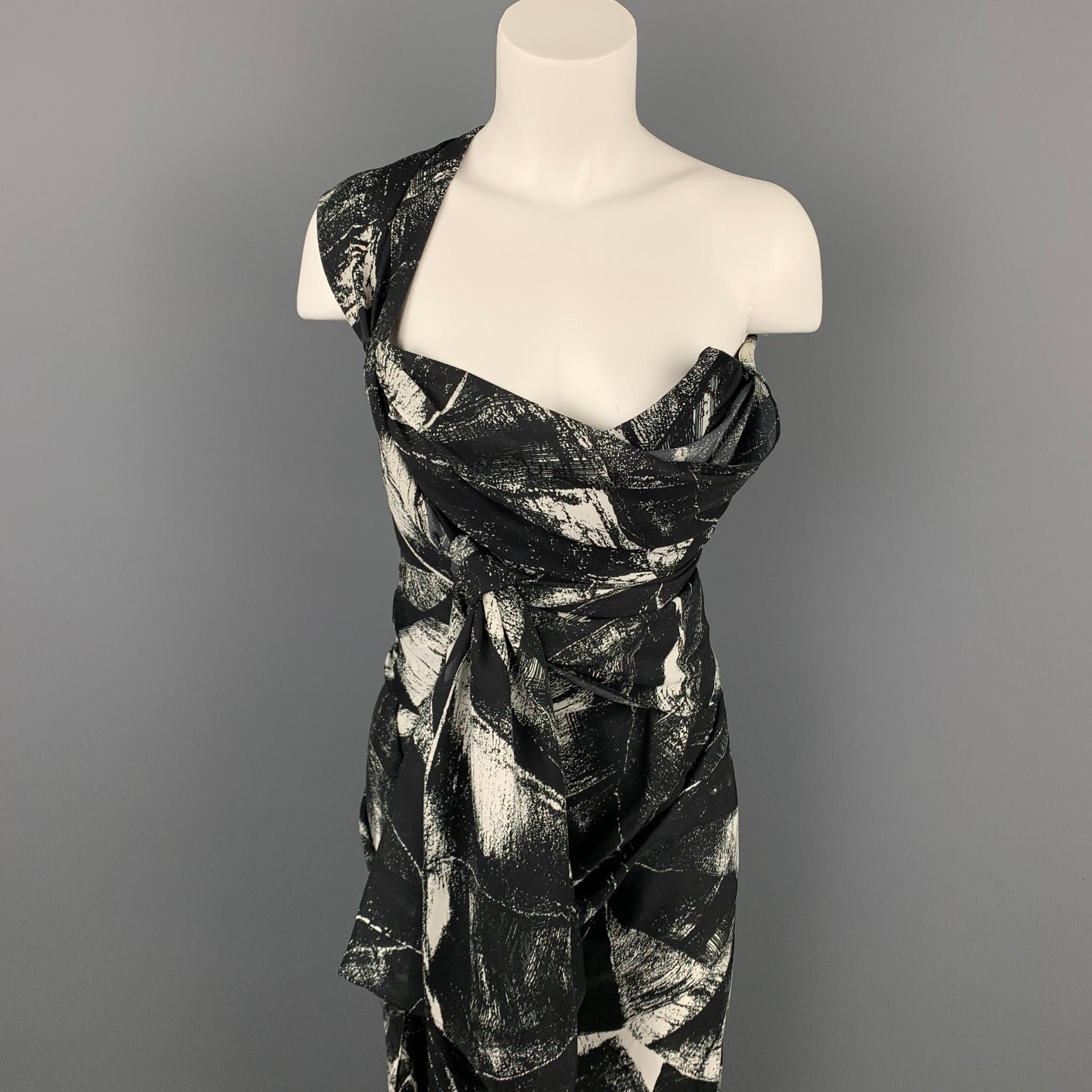 VIVIENNE WESTWOOD cocktail dress comes in a black & white marbled silk featuring a strapless corset design, wrap detail, and a back zip up closure. Made in Italy. 

Very Good Pre-Owned Condition.
Marked: UK 12 / US 8

Measurements:

Bust: 30