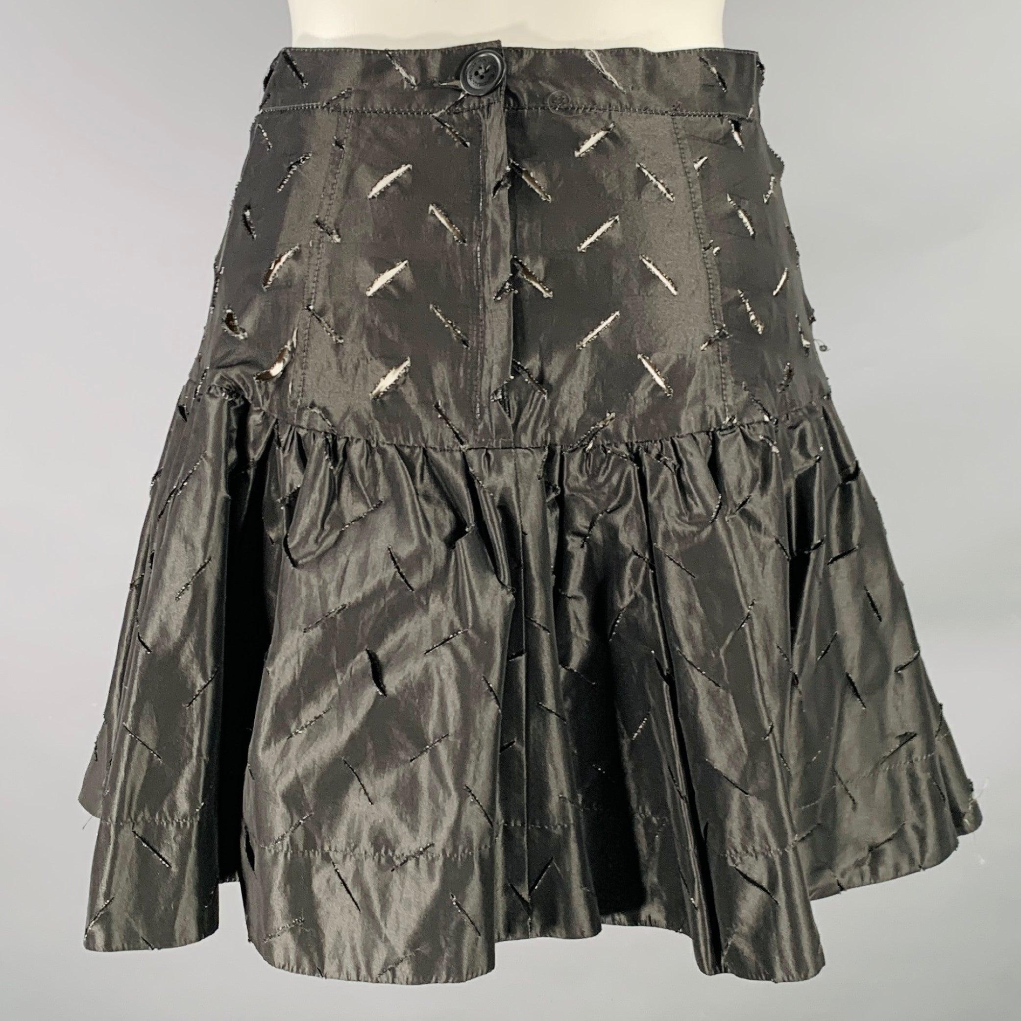 VIVIENNE WESTWOOD ANGLOMANIA mini skirt
in a black acetate blend fabric featuring a pleated style, all over cutouts, and back zipper closure. Made in Italy.Excellent Pre-Owned Condition. 

Marked:   IT 42 

Measurements: 
  Waist: 25 inches Hip: 36