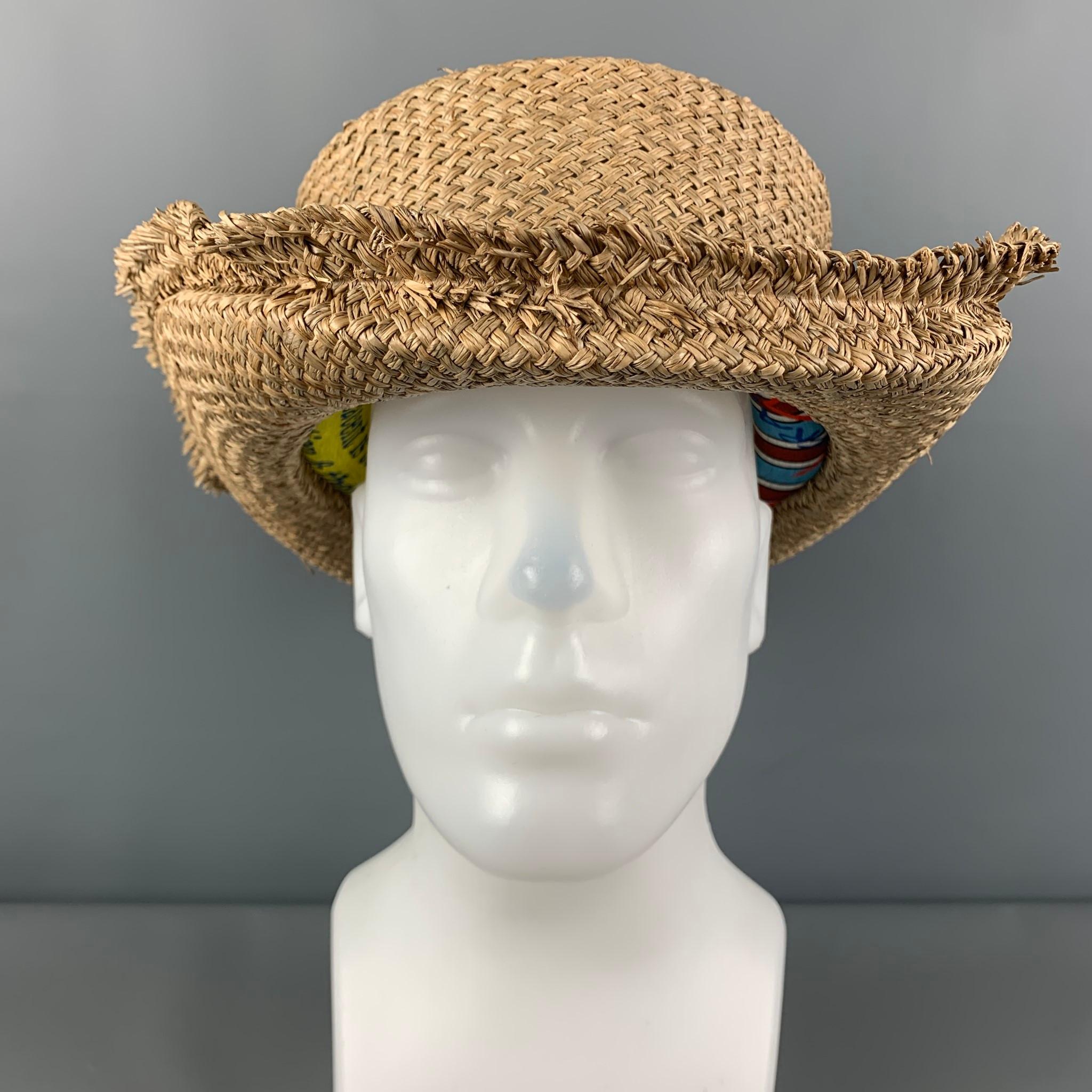 VIVIENNE WESTWOOD hat comes in a natural woven straw material featuring a raw edge and a inner multi-color cushion detail. 

Very Good Pre-Owned Condition.
Marked: Size tag removed.

Measurements:

Opening: 25.5 in.
Brim: 3.5 in.
Height: 4 in.