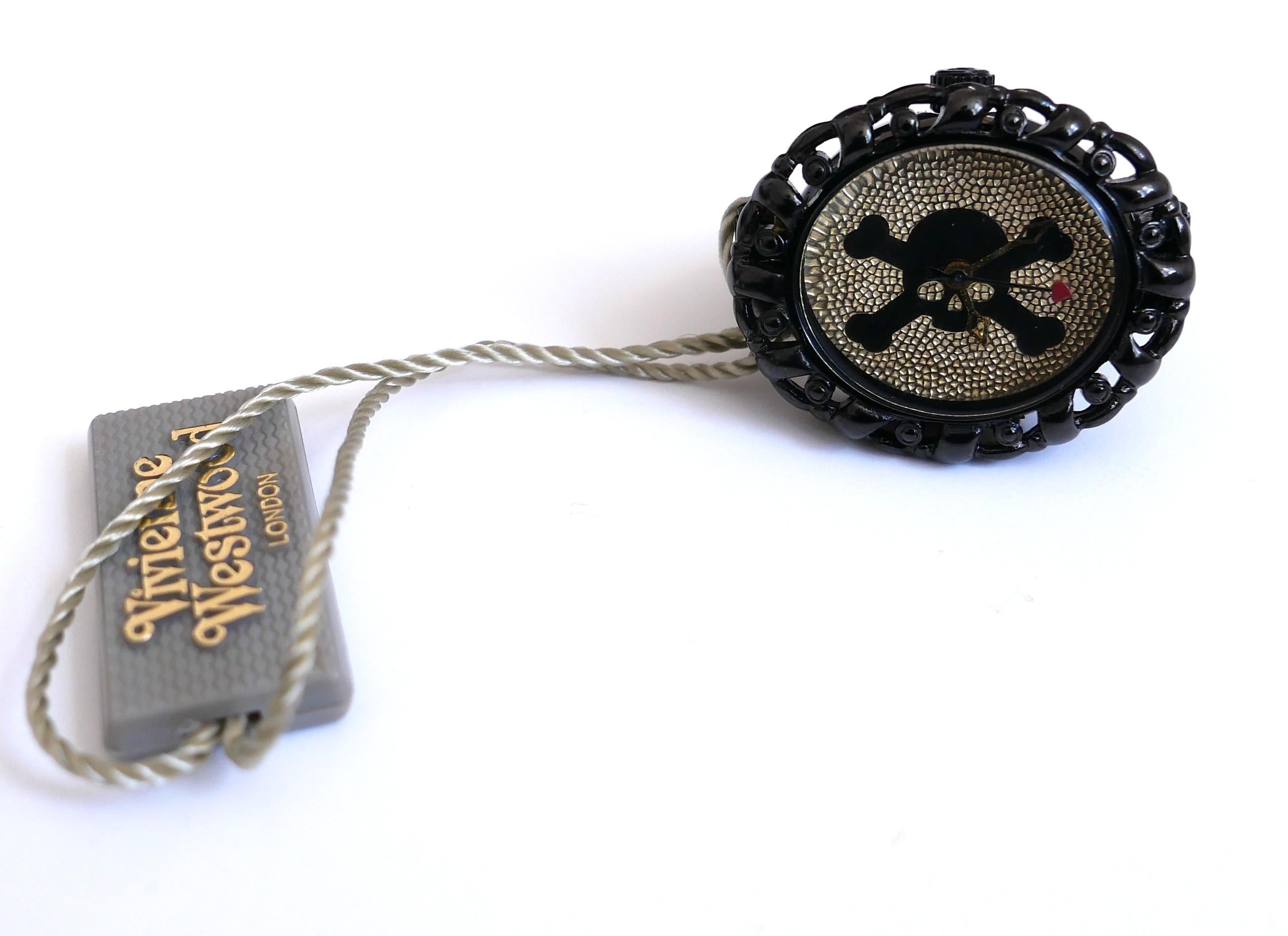 Super cute Vivienne Westwood watch ring. New with tag. Made from black painted metal with gold skull and crossbones face and elasticated band. Case measures approx 1.25” across. One size 
