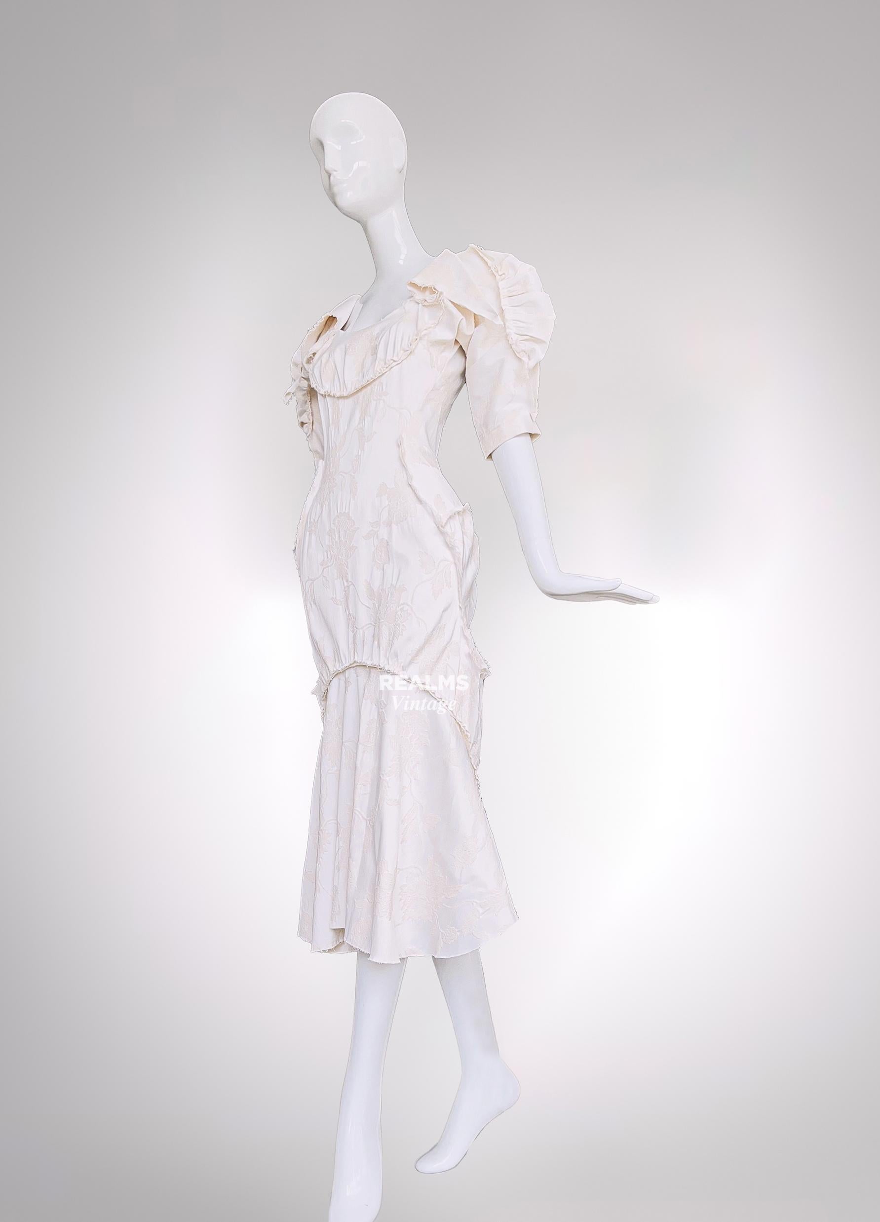 Vivienne Westwood SS 2020 Dress
New, unworn

Cut from beautiful flower jacquard fabric, tailored with voluminous elements and frayed gathered seams for a patchwork effect. The cotton-blend Cocoon Dress is inspired by colours, patterns and volume of
