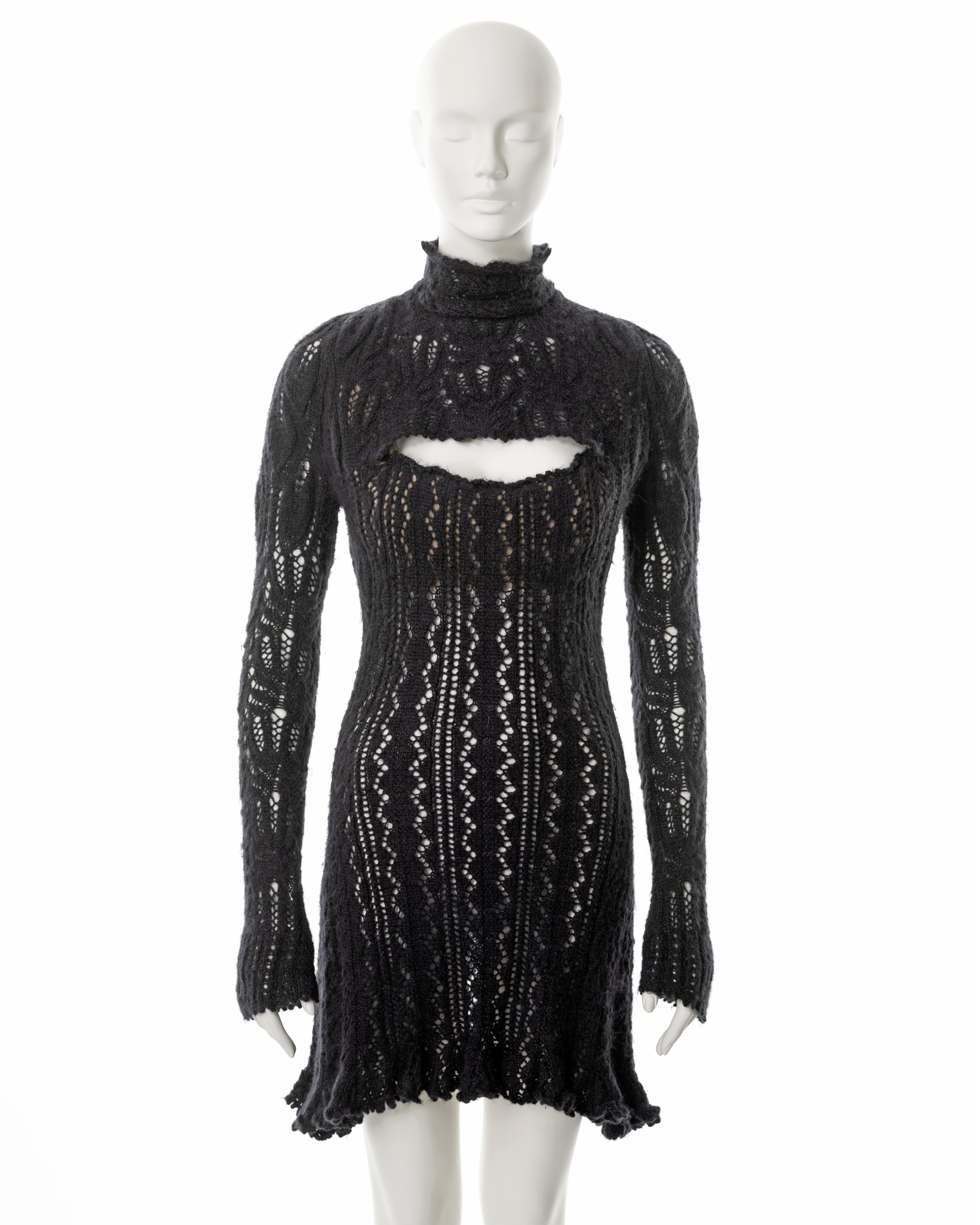 ▪ Vivienne Westwood knitted mini dress
▪ Sold by One of a Kind Archive
▪ Fall-Winter 1993
▪ Constructed from steel-grey open-knit alpaca wool with graduated leaf motifs
▪ Nude internal corset produces a pronounced décolletage, visible through the