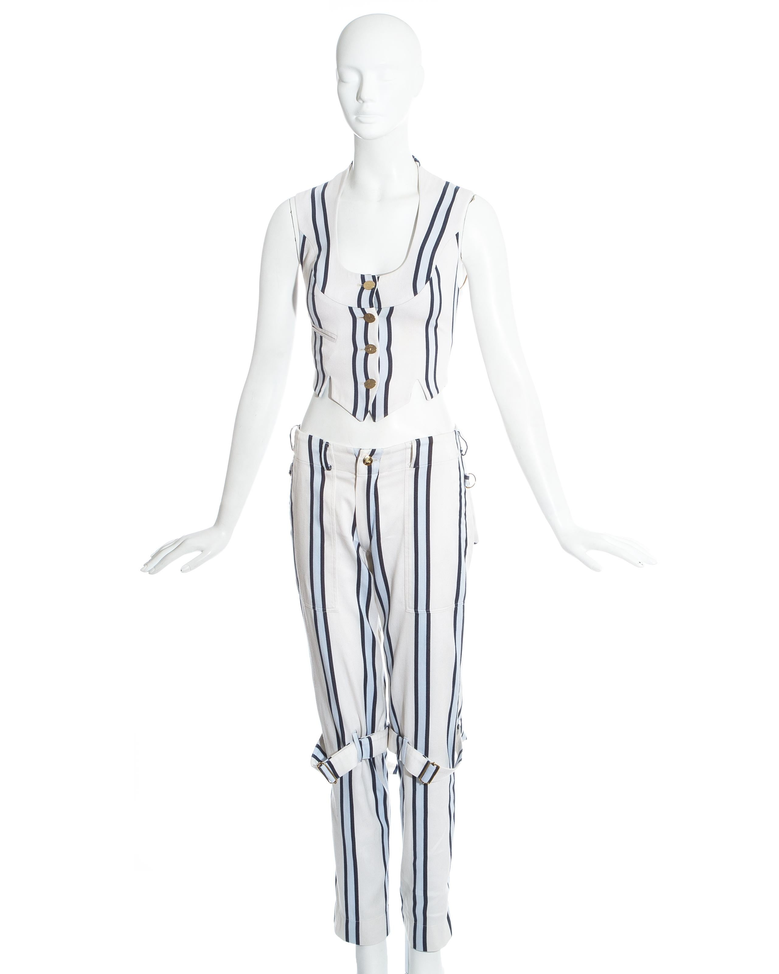 Vivienne Westwood striped blue and white cotton pant suit. Bondage pants with multiple zips fastenings. Fitted button up waistcoat. 

Cafe Society, Spring-Summer 1994