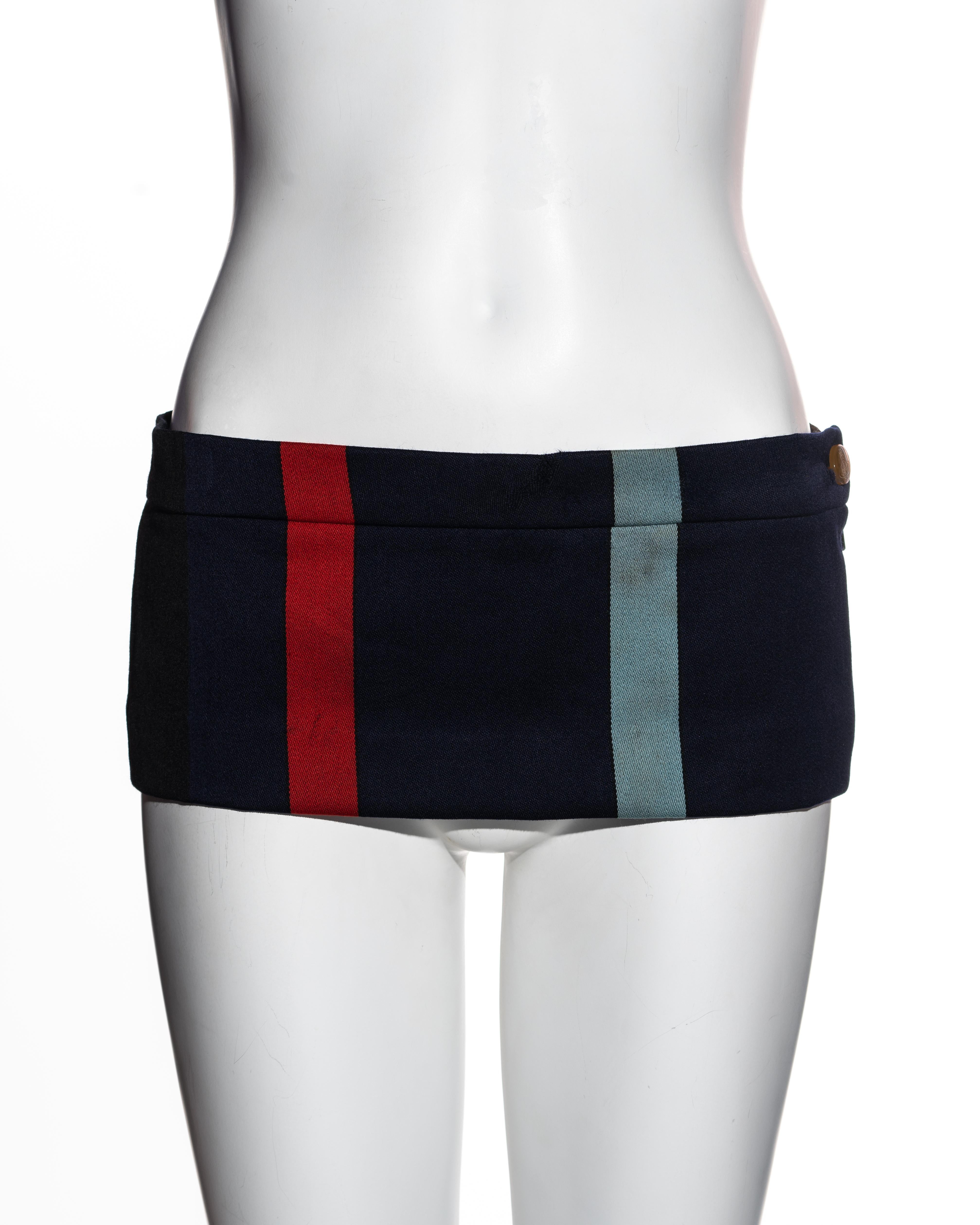 ▪ Vivienne Westwood striped wool micro mini skirt 
▪ Red, navy, black, brown, white and sky blue stripes
▪ Length: 16 cm / 6.3 inch
▪ Orb etched button 
▪ Concealed zipper at side seam 
▪ Back vent 
▪ An iconic design worn on the runway by Kate Moss