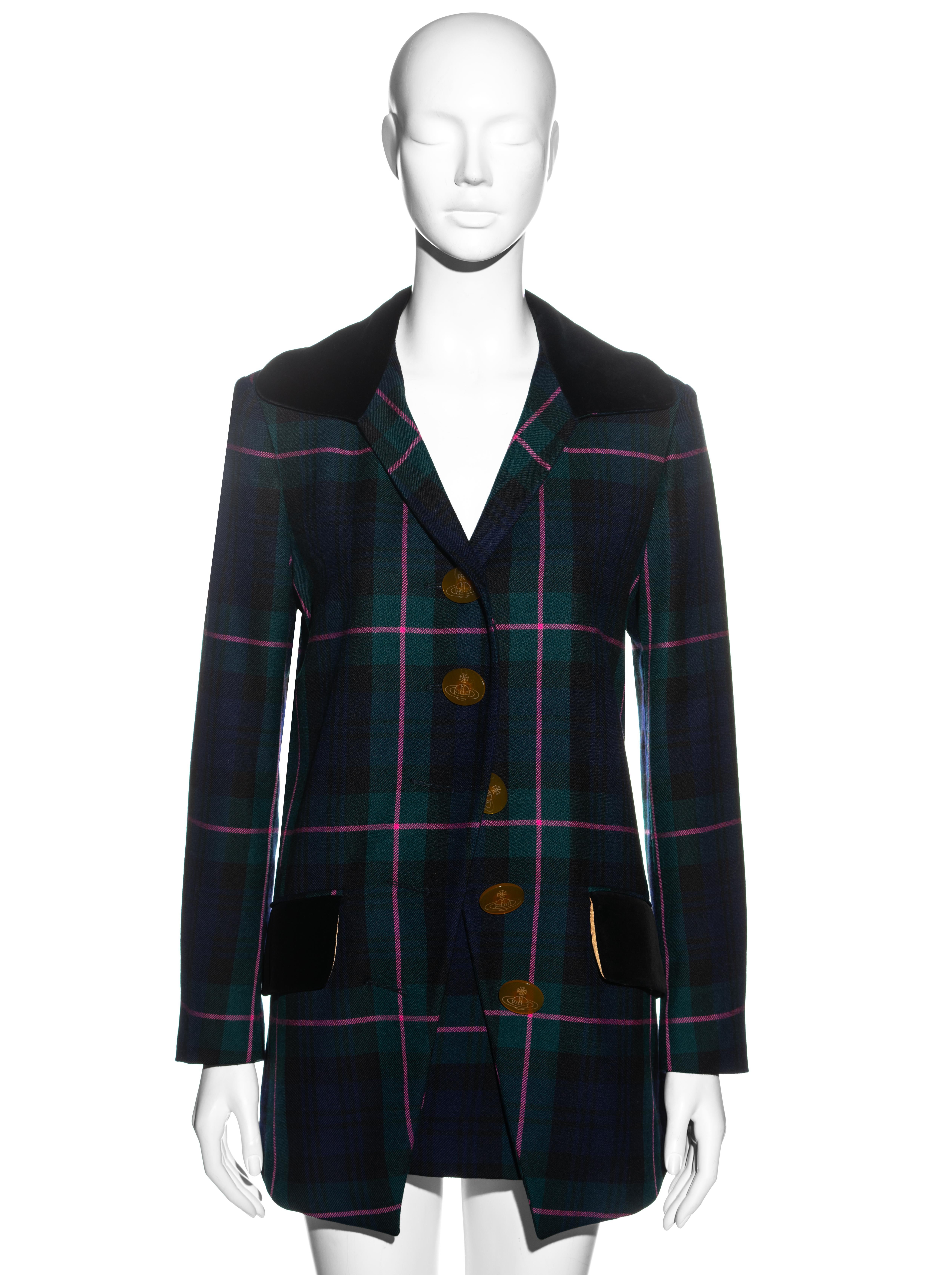 ▪ Vivienne Westwood tartan wool skirt suit
▪ 100% Wool
▪ Navy, green and pink tartan print 
▪ Large orb etched buttons 
▪ Black velvet collar and pocket flaps 
▪ Matching high waist mini skirt 
▪ IT 42 - FR 38 - UK 10 - US 6
▪ Fall-Winter 1993